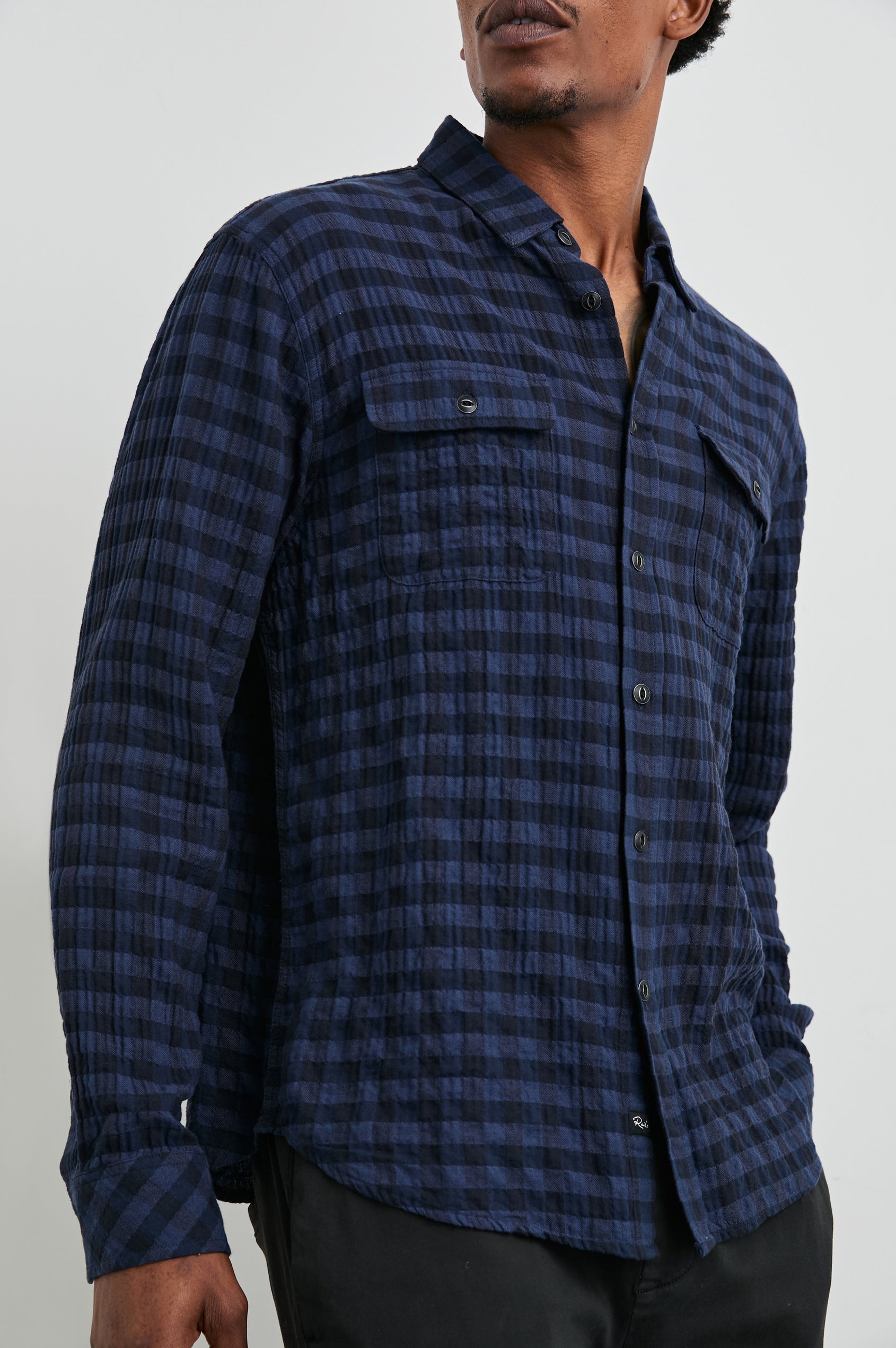 Powell Long-Sleeve Button Up with Textured Cotton and Two Chest Buttoned Flap Pockets in Blue Jay Royal Colorway, a Blue and Black plaid - Front View Featured on Model