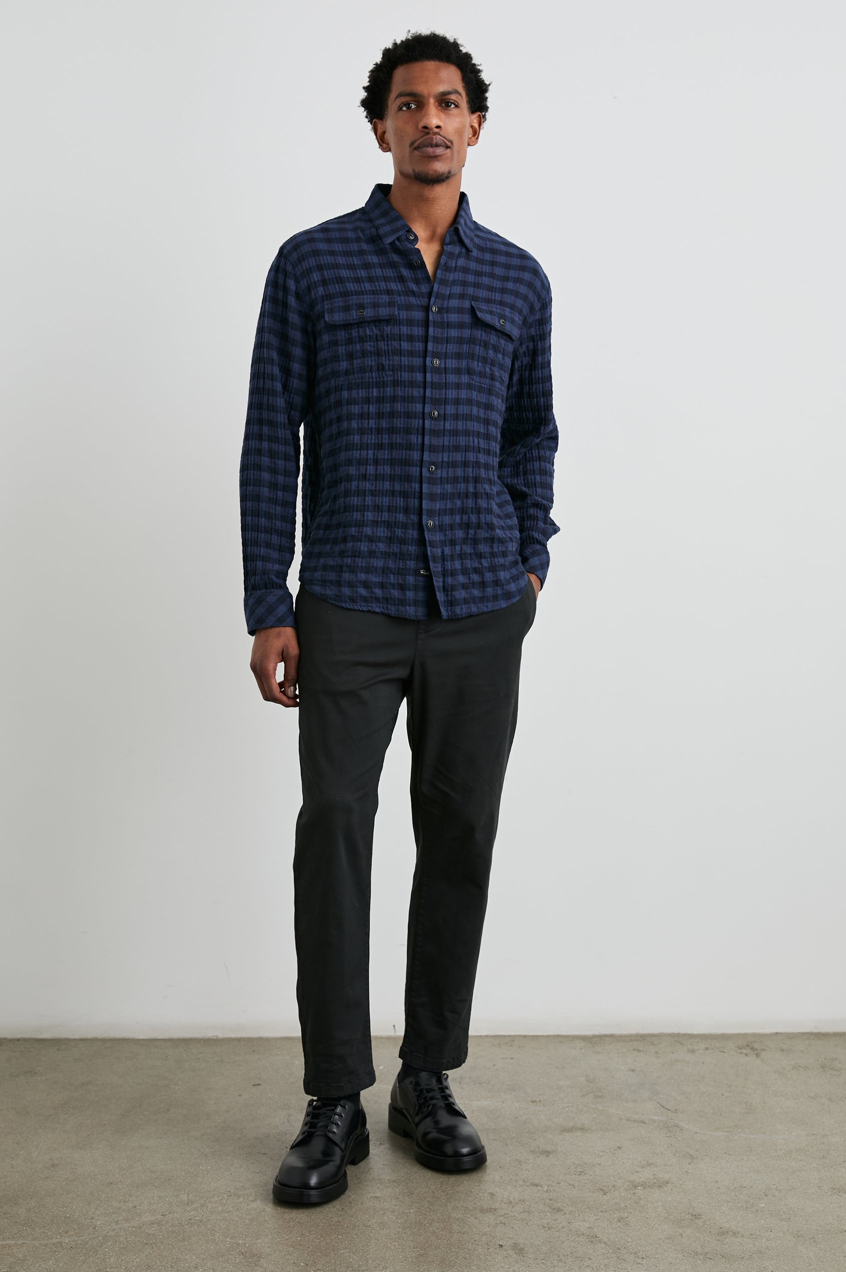Powell Long-Sleeve Button Up with Textured Cotton and Two Chest Buttoned Flap Pockets in Blue Jay Royal Colorway, a Blue and Black plaid - Front Full Body View Featured on Model