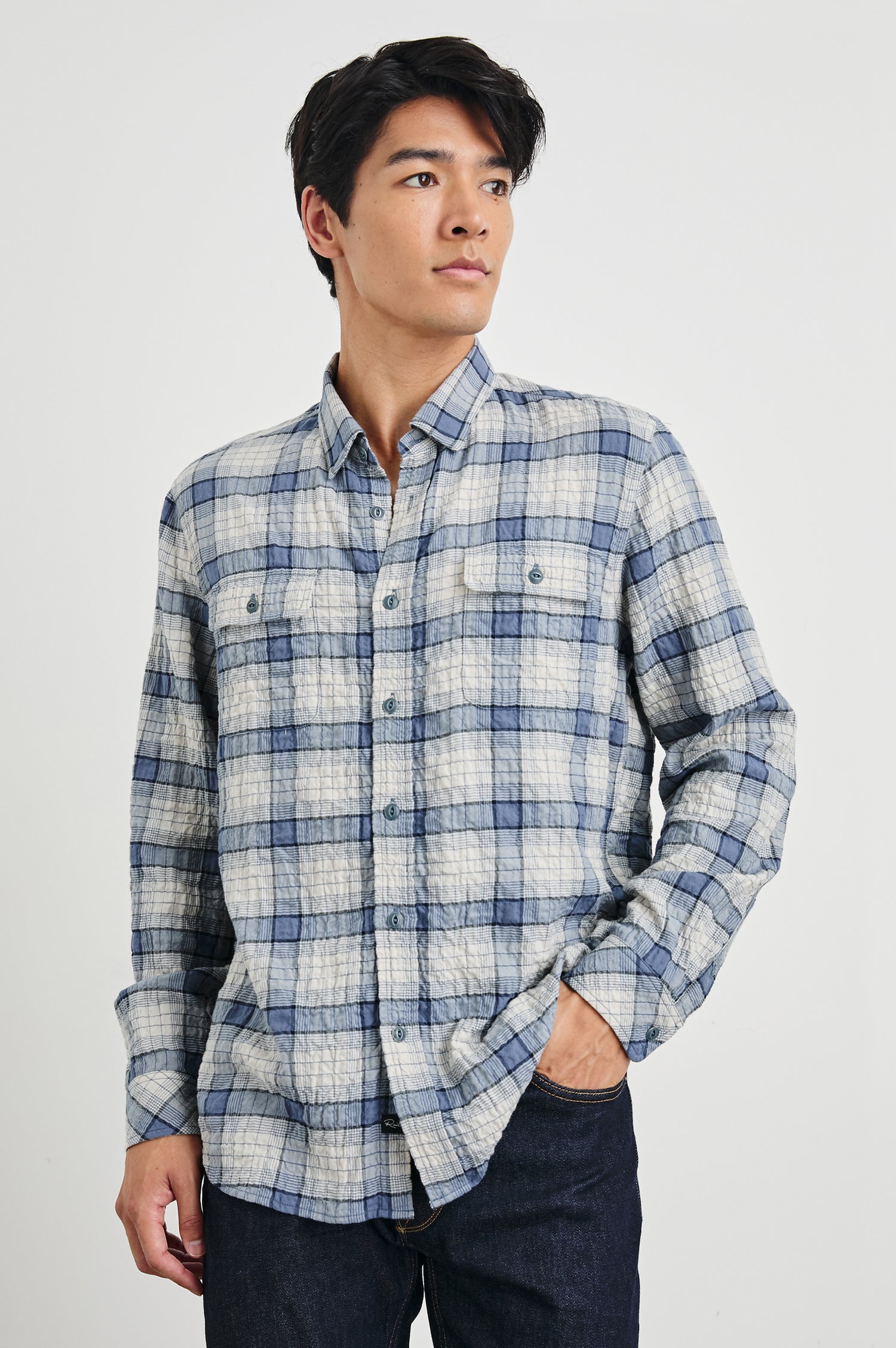 Powell Long-Sleeve Button Up with Textured Cotton and Two Chest Buttoned Flap Pockets in Paper Iris Colorway, a white and blue plaid - Front View Featured on Model
