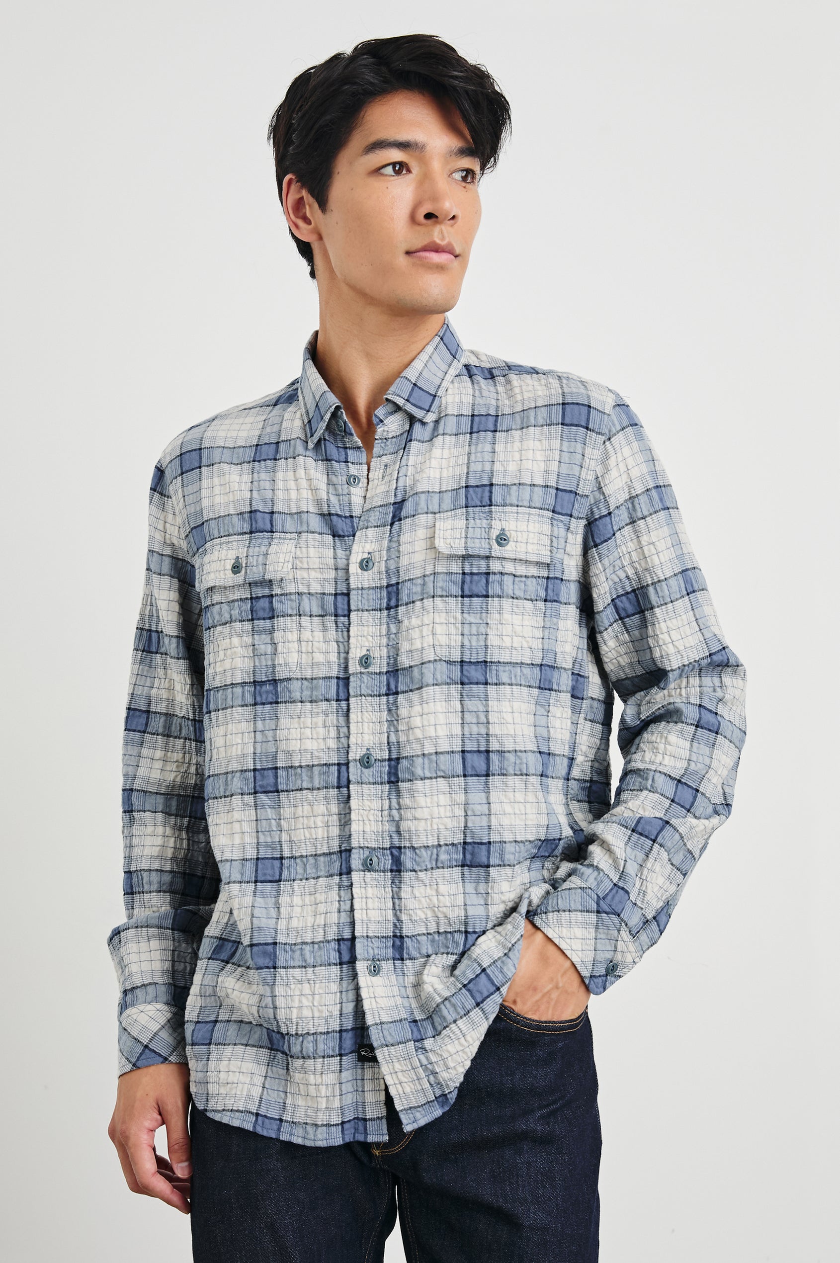 Powell Long-Sleeve Button Up with Textured Cotton and Two Chest Buttoned Flap Pockets in Paper Iris Colorway, a white and blue plaid - Front View Featured on Model