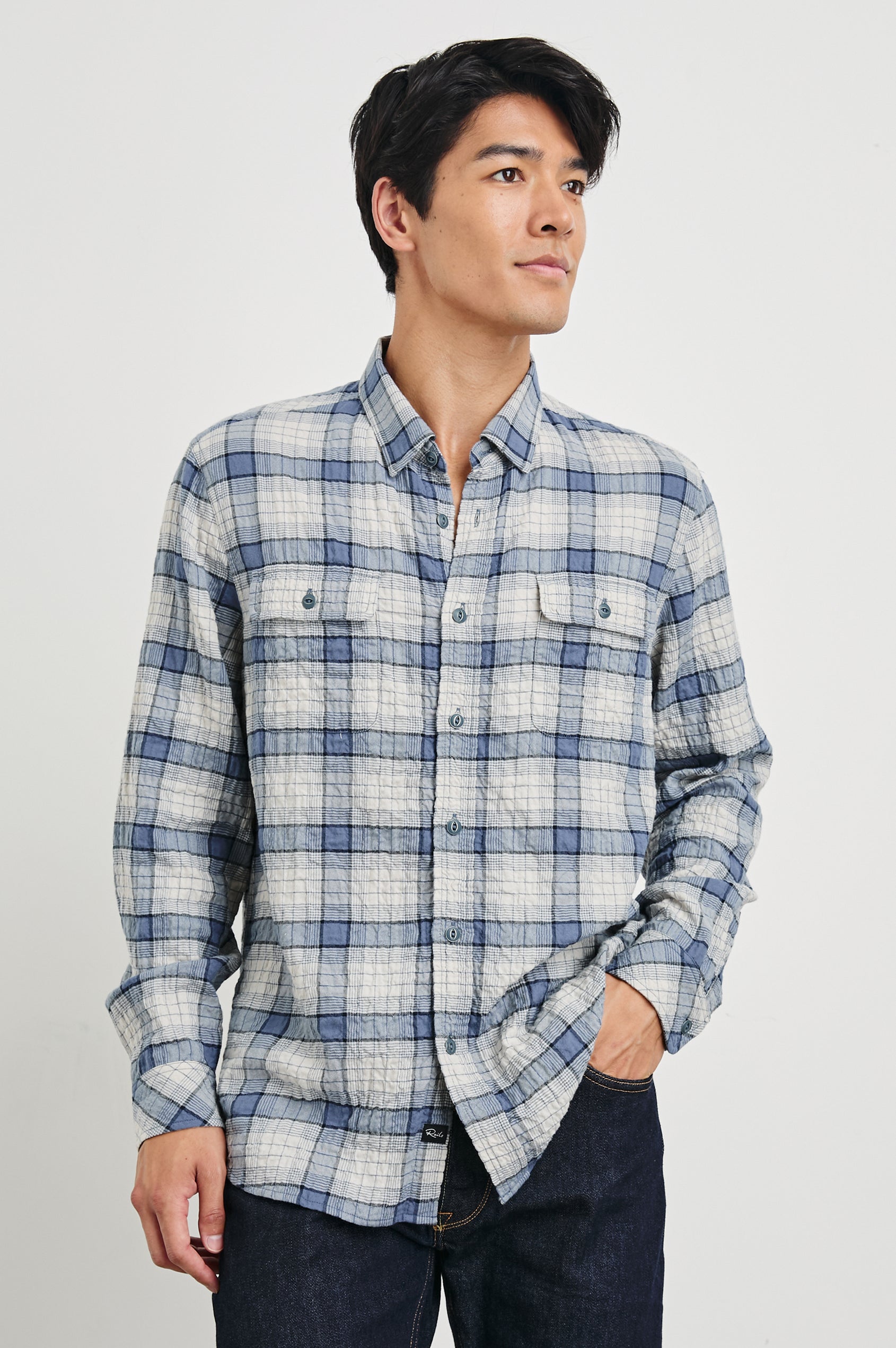 Powell Long-Sleeve Button Up with Textured Cotton and Two Chest Buttoned Flap Pockets in Paper Iris Colorway, a white and blue plaid - Front View Featured on Model