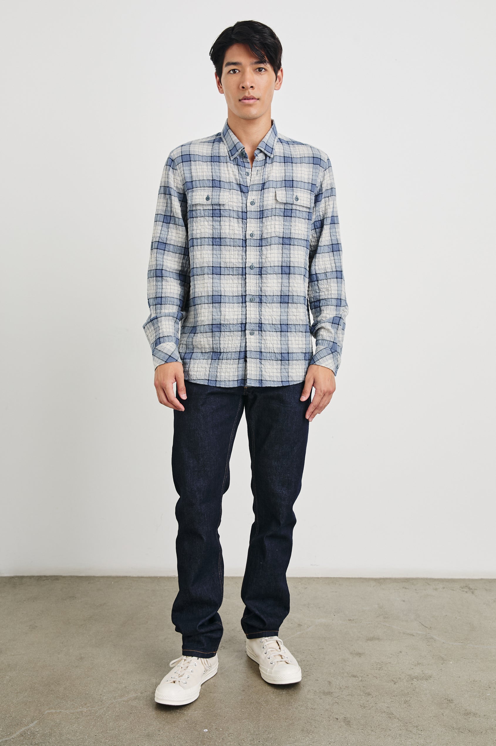 Powell Long-Sleeve Button Up with Textured Cotton and Two Chest Buttoned Flap Pockets in Paper Iris Colorway, a white and blue plaid - Front Full Body View Featured on Model