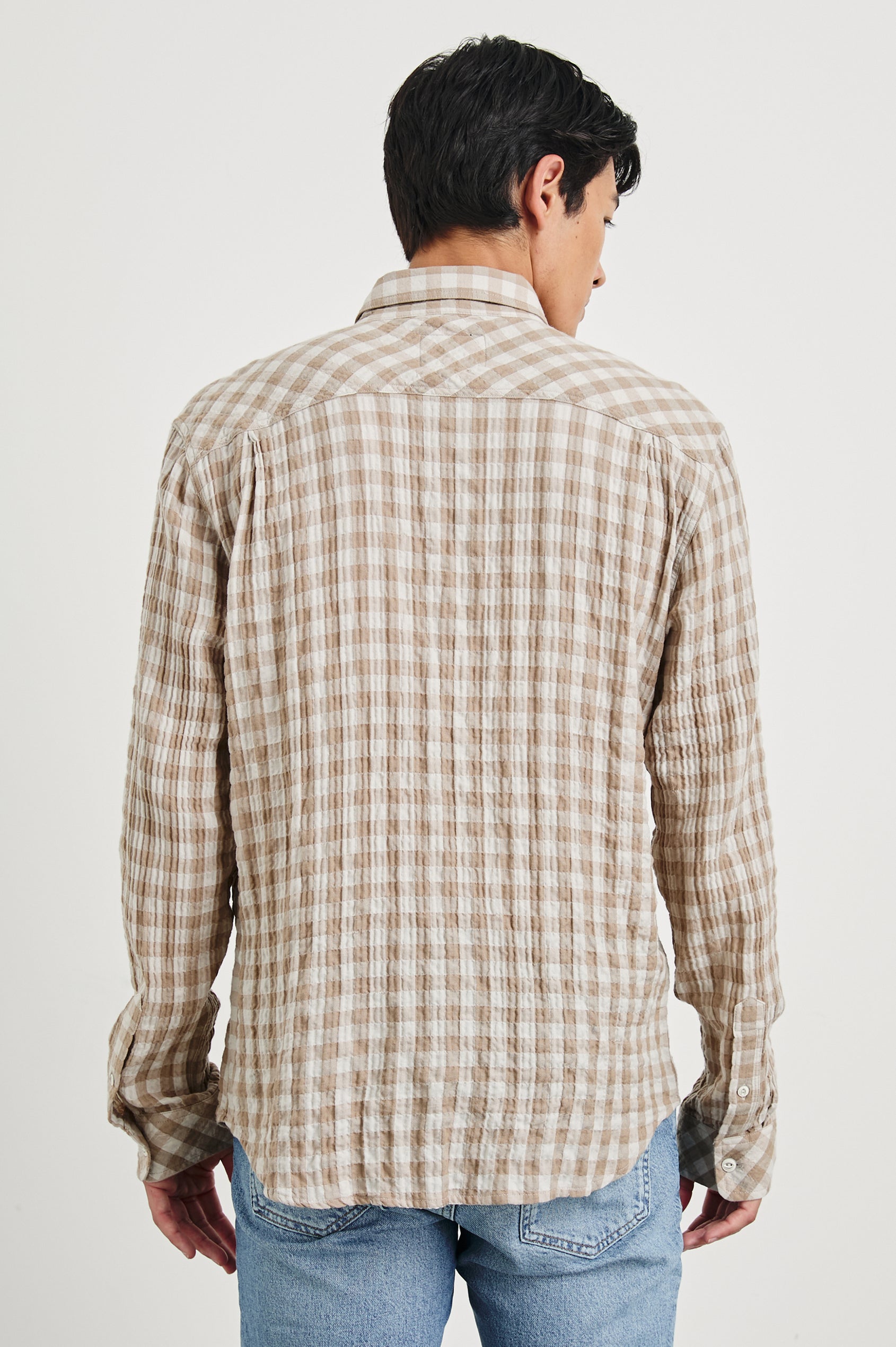 Powell Long-Sleeve Button Up with Textured Cotton and Two Chest Buttoned Flap Pockets in Tumbleweed Dune Colorway, a tan and cream plaid - Back View Featured on Model