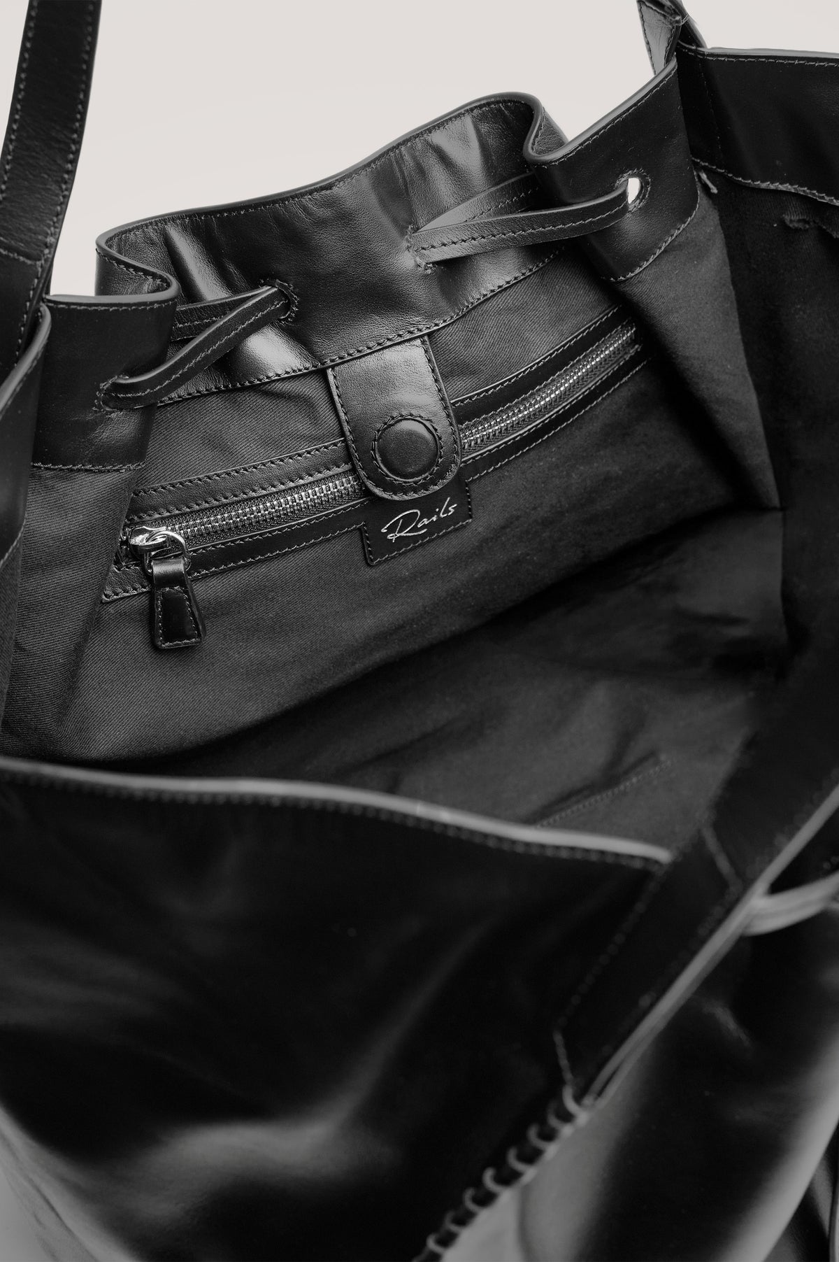 Prato Bucket Tote in Leather With Whipstitch Trim, Fixed Top Straps, Drawcord Closure, Interior Zip Pocket, Interior Slip Pocket in Black Colorway - Front Product View Featured