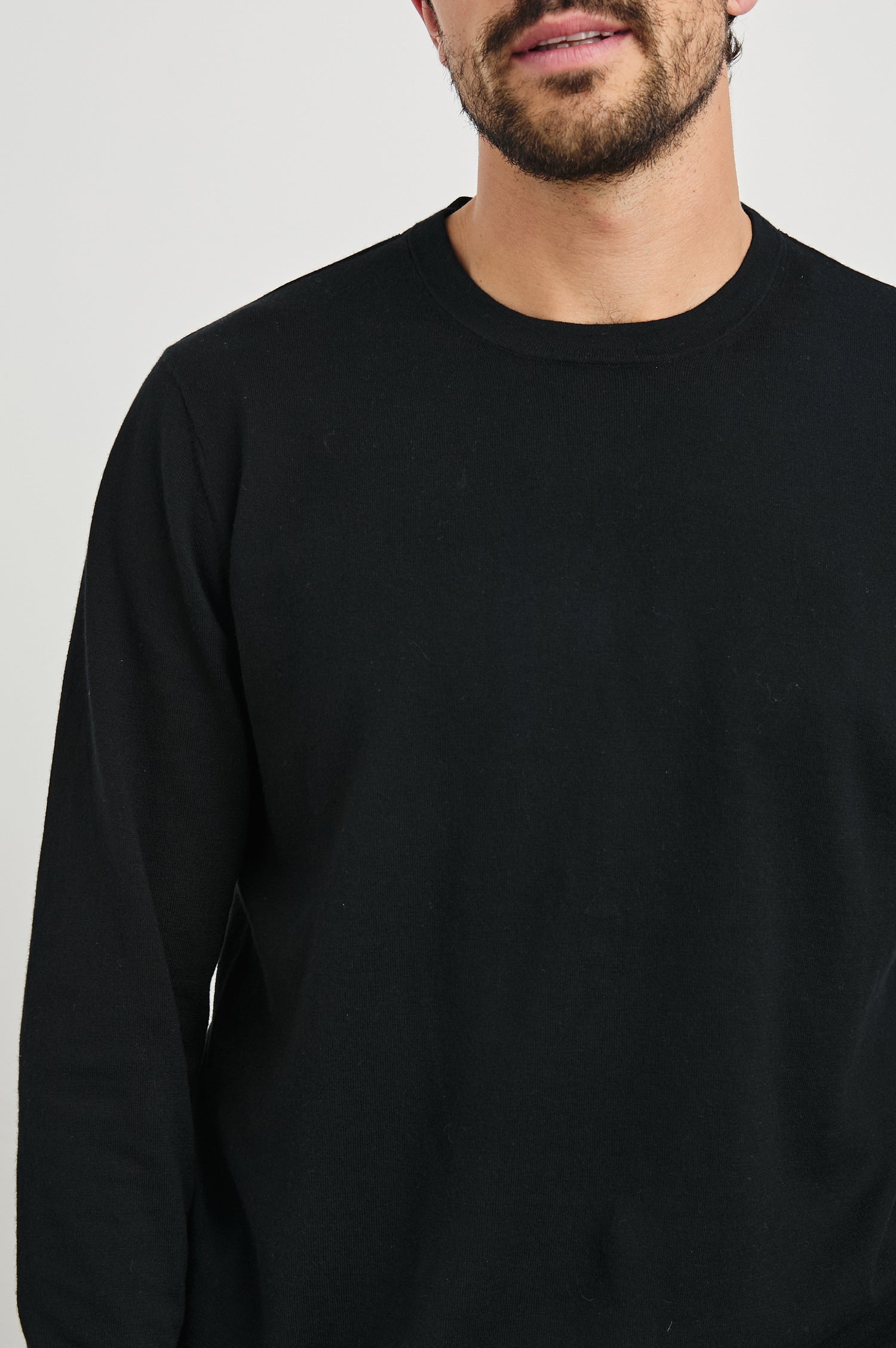 Quentin Cotton Cashmere Long Sleeve Tee with a Crew Neck in Black Colorway - Front View Featured on Model
