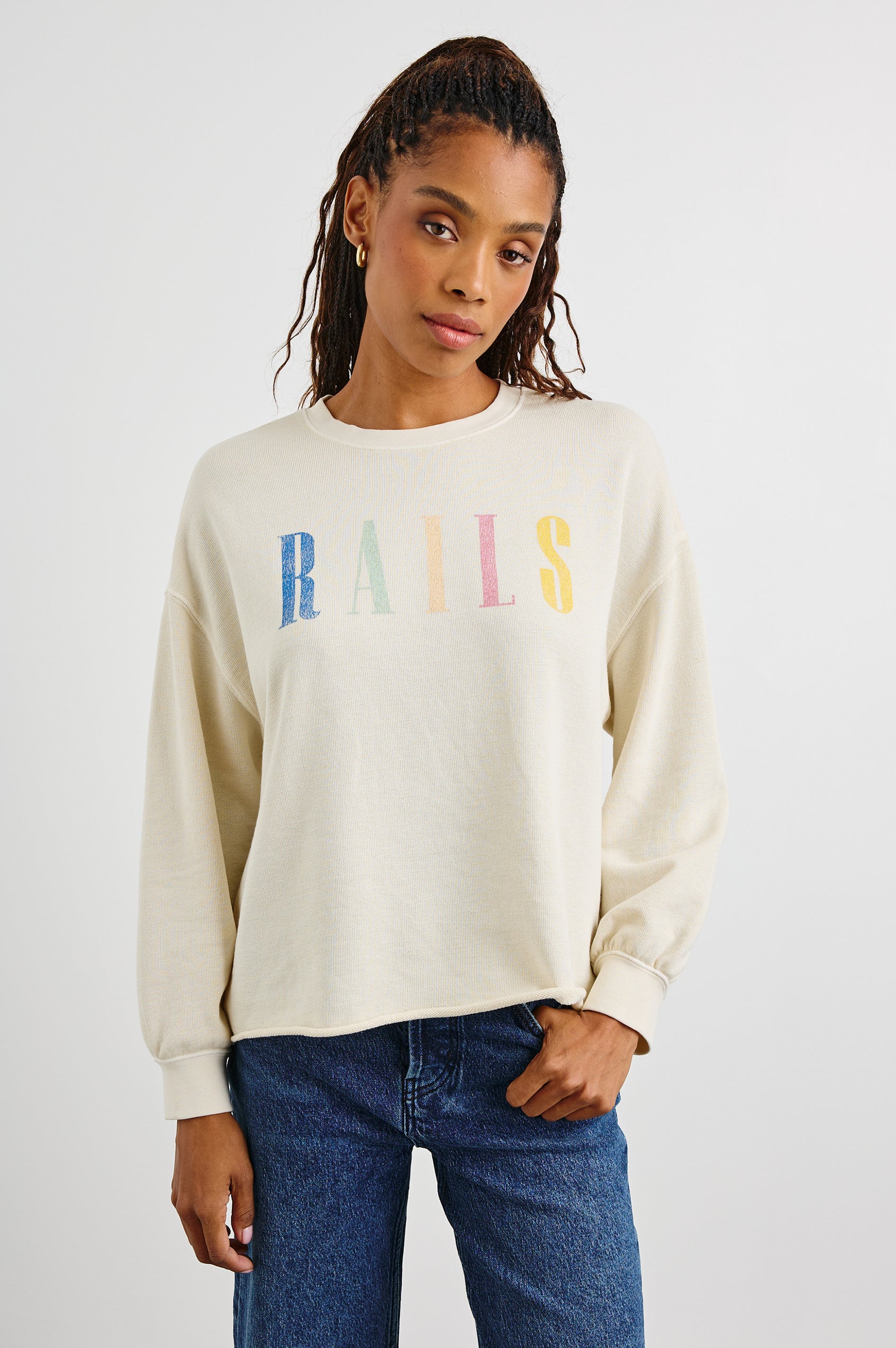 Rails Signature Long-Sleeve Sweatshirt with a Crew Neck, Raw Hem, Shirring Above Cuff, and the Text, Rails, in Ivory Colorway, with Multi Colored Text - Front View Featured on Model 