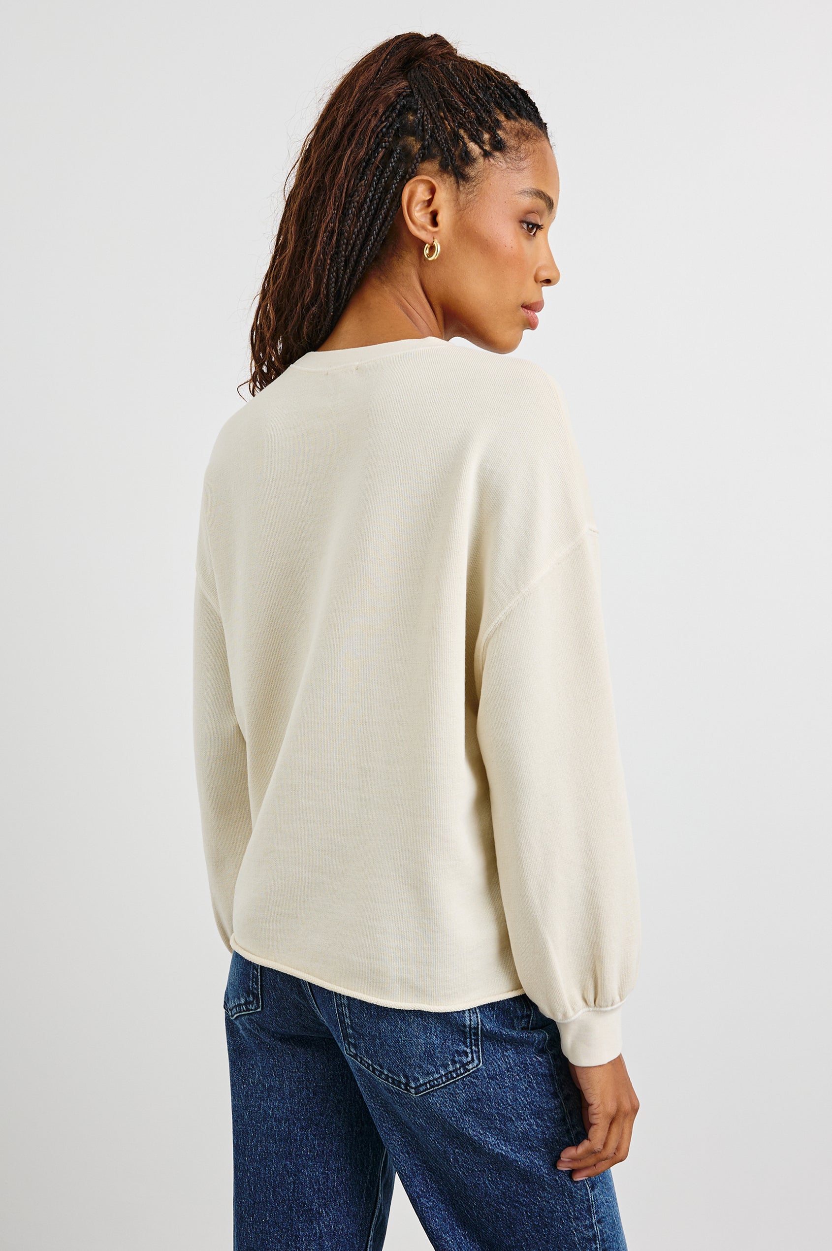 Rails Signature Long-Sleeve Sweatshirt with a Crew Neck, Raw Hem, Shirring Above Cuff, and the Text, Rails, in Ivory Colorway, with Multi Colored Text - Back View Featured on Model 