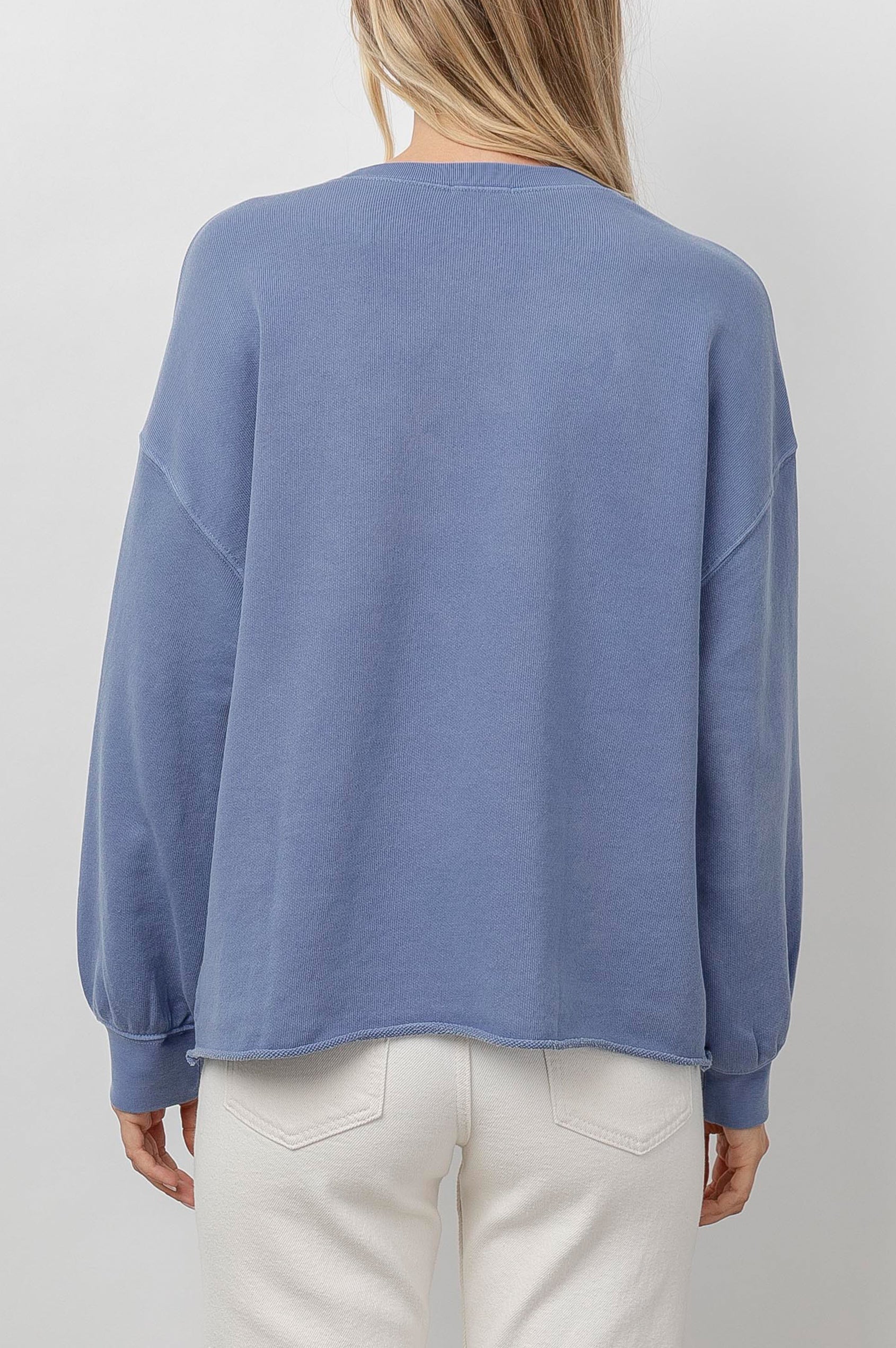 Rails Signature Long-Sleeve Sweatshirt with a Crew Neck, Raw Hem, Shirring Above Cuff, and the Text, Rails, in Washed Indigo Rails Colorway, with Ivory Text - Back View Featured on Model 