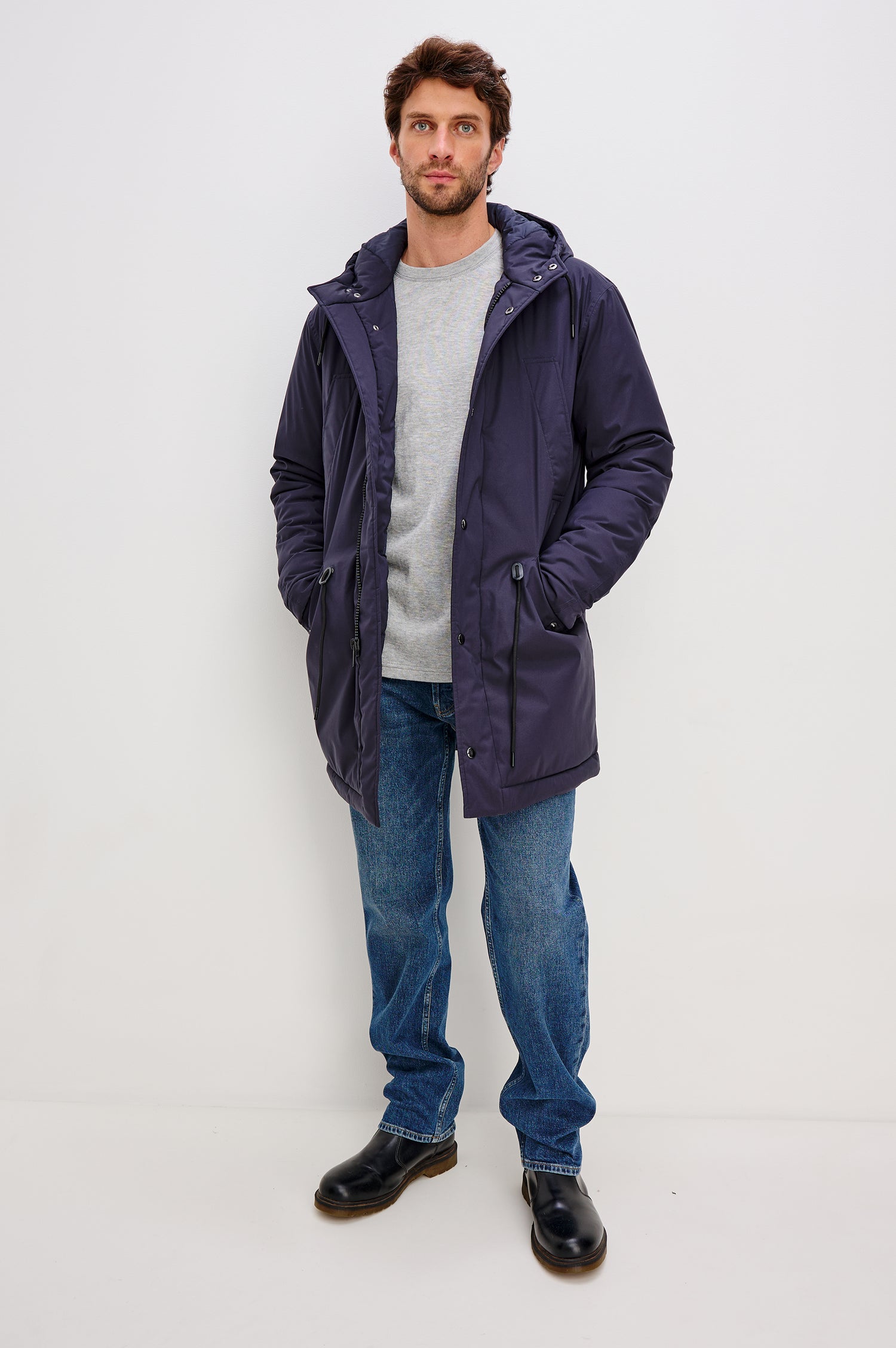 Rainier Parka Coat With Drawcord Hood in Water-Resistant Nylon, Side Snap Button Pockets, Double Front Snap Flap, and Back Seam Vent in Navy Colorway - Full Body Front View Featured on Model
