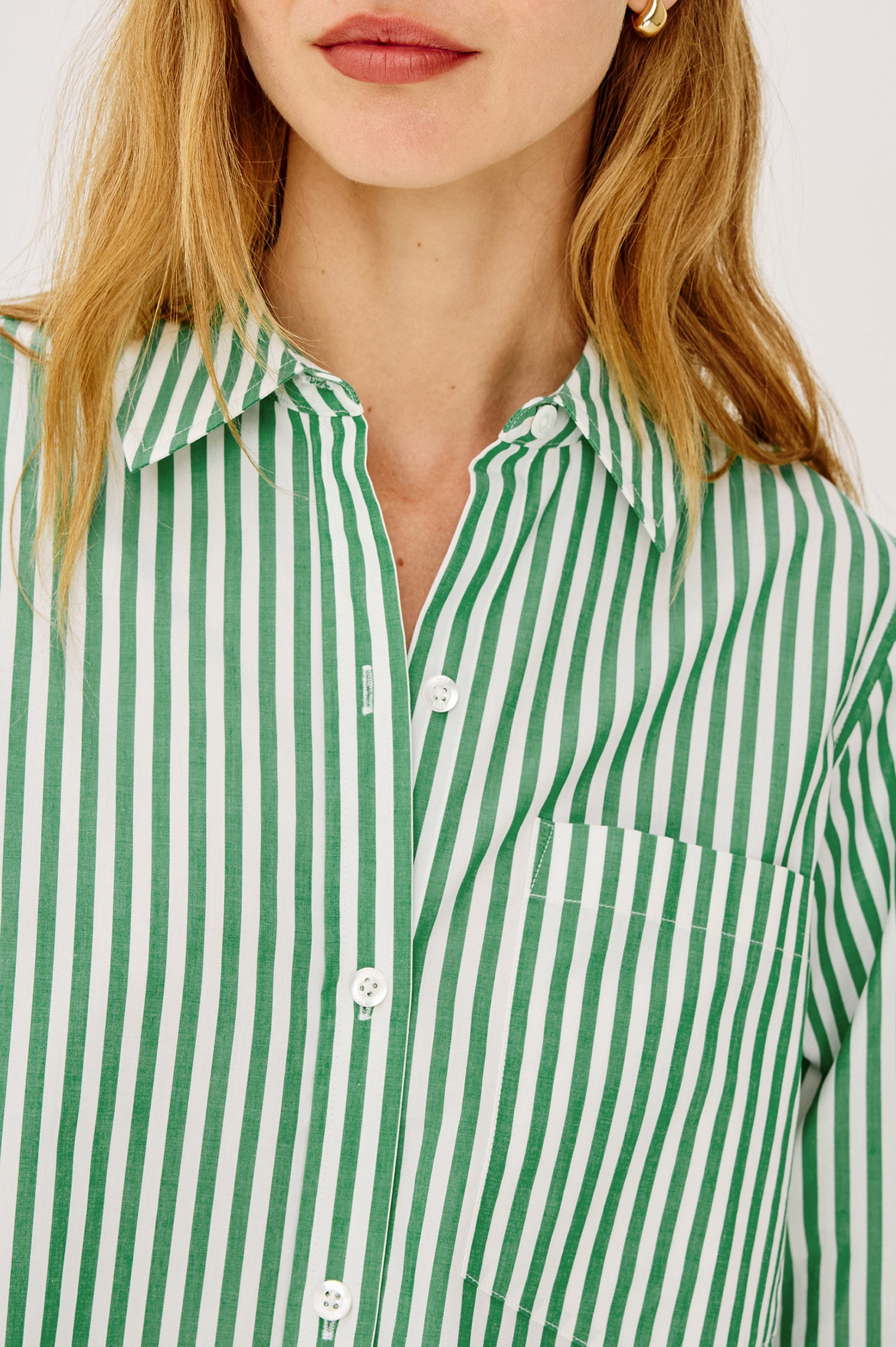 Ramy Crop Shirt in Cotton Poplin With Button-Up Placket, Collar, Chest Patch Pocket, Long Sleeves, and a Loose, Boxy Fit in Emerald Stripe Colorway - Upper Body Front View Featured on Model