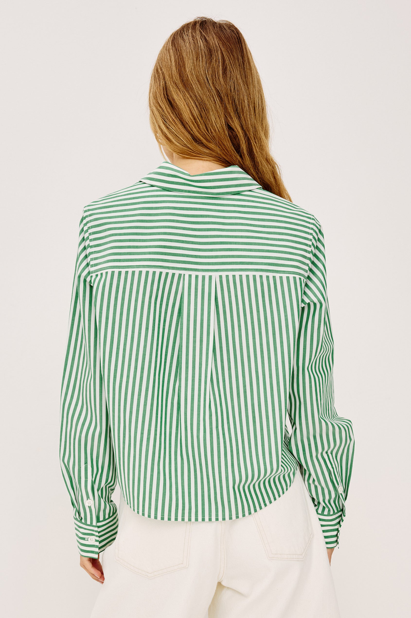 Ramy Crop Shirt in Cotton Poplin With Button-Up Placket, Collar, Chest Patch Pocket, Long Sleeves, and a Loose, Boxy Fit in Emerald Stripe Colorway - Upper Body Back View Featured on Model