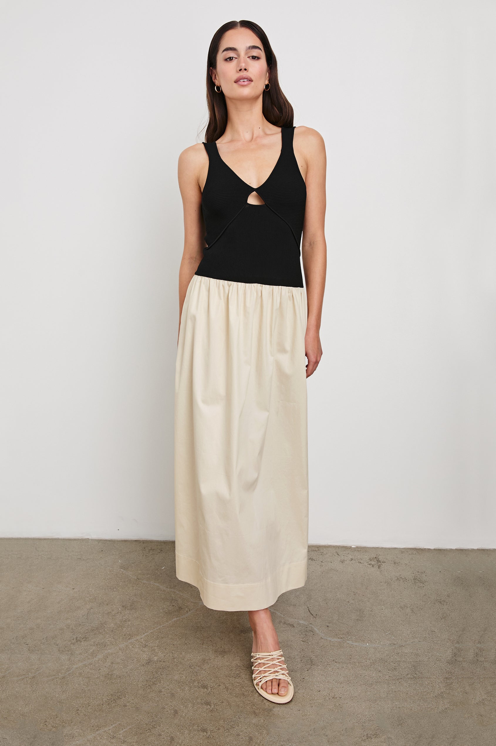 Raquel Maxi Dress with Straps, a Scoop Neckline with Keyhole and Pleats at Waistline in Black Ivory Colorway - front view on model walking