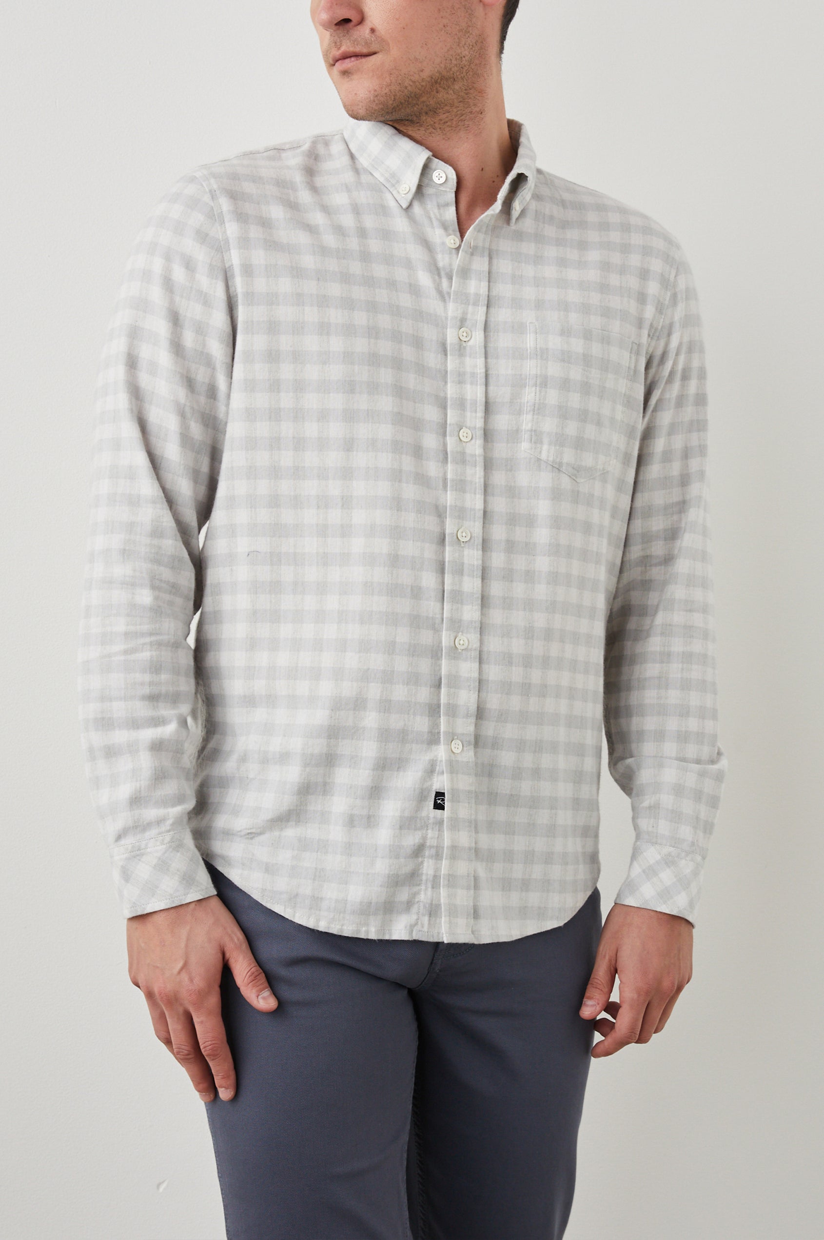 Reid Long-Sleeve Button Up with a Patch Pocket in Alloy White Melange Colorway, a Grey and White plaid - Front View Featured on Model