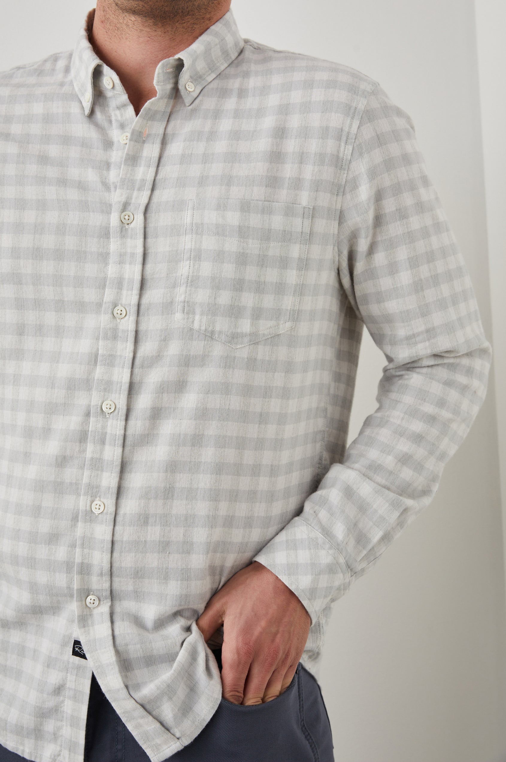 Reid Long-Sleeve Button Up with a Patch Pocket in Alloy White Melange Colorway, a Grey and White plaid - Front View Featured on Model