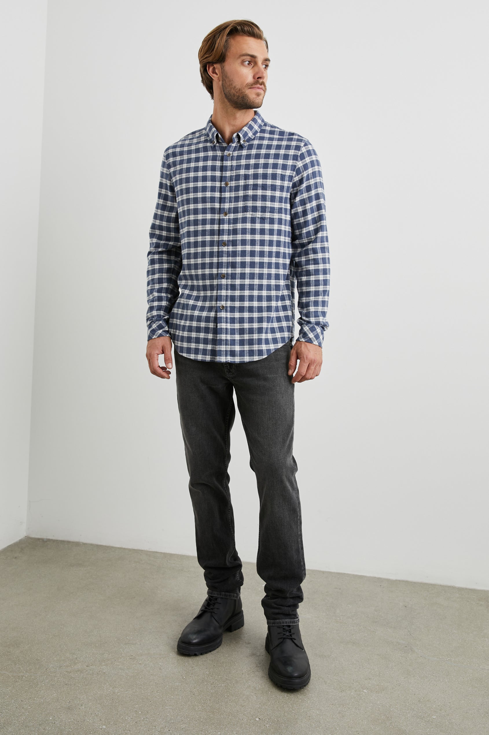 Reid Long-Sleeve Button Up with a Patch Pocket in Midnight Grey Melange Colorway, a Blue, Grey and Cream plaid - Front Full Body View Featured on Model