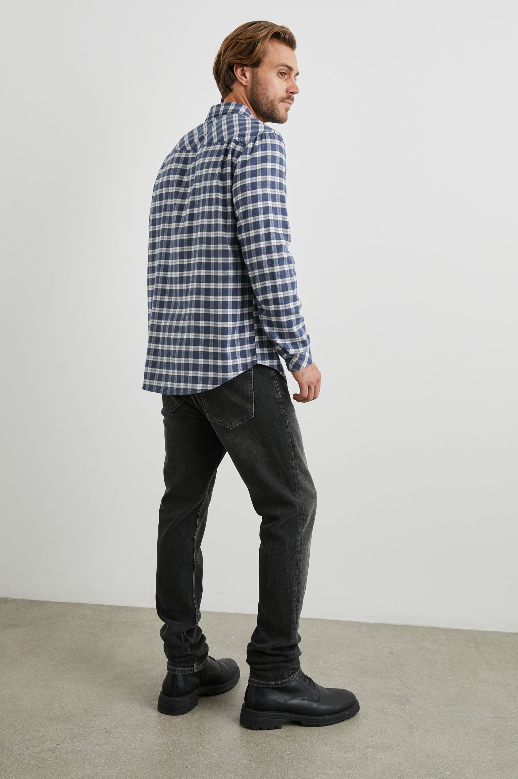 Reid Long-Sleeve Button Up with a Patch Pocket in Midnight Grey Melange Colorway, a Blue, Grey and Cream plaid - Back Full Body View Featured on Model