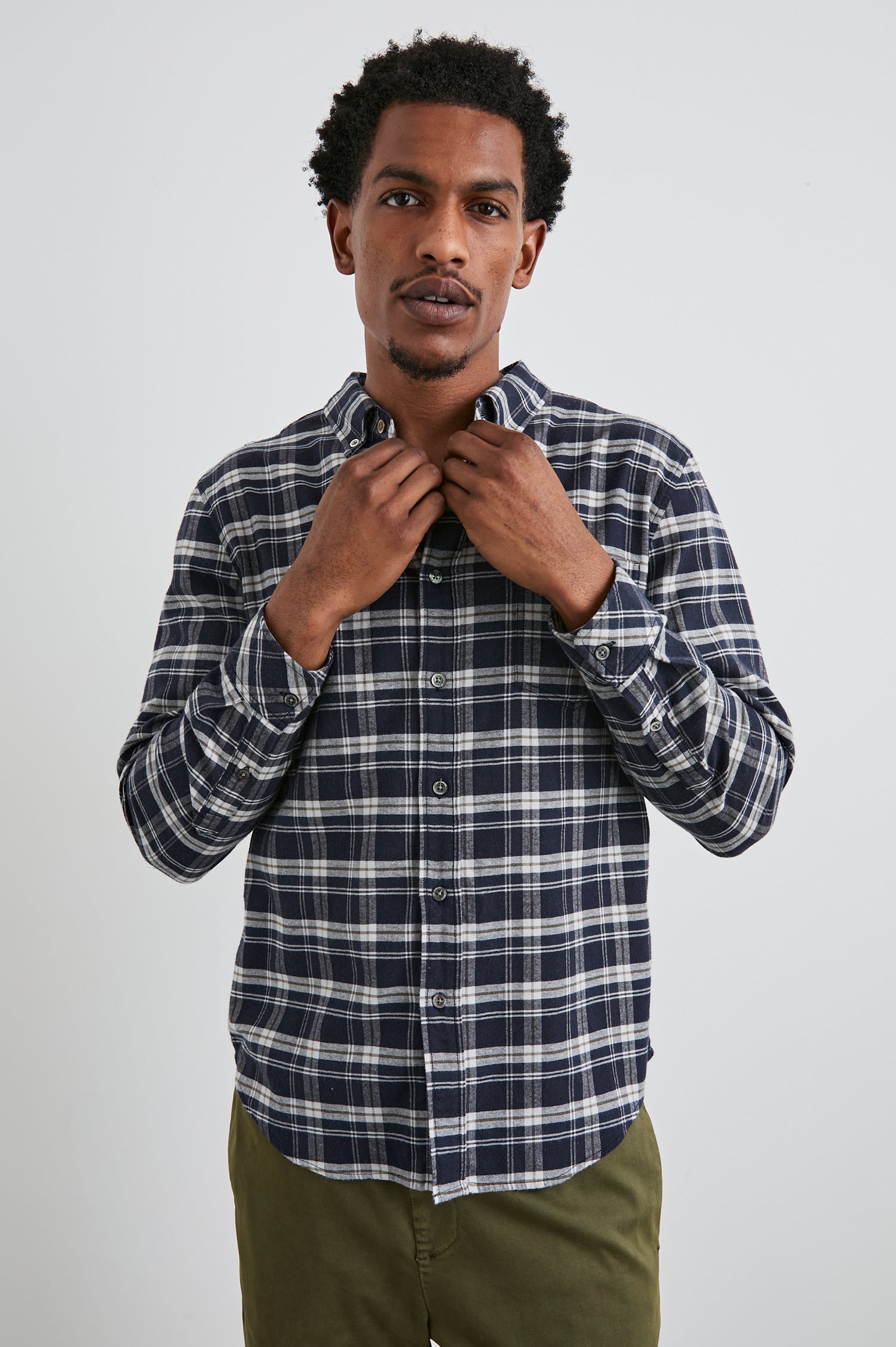 Reid Long-Sleeve Button Up with a Patch Pocket in Navy Lentil Cream Colorway, a Navy, Cream and Brown plaid - Front View Featured on Model