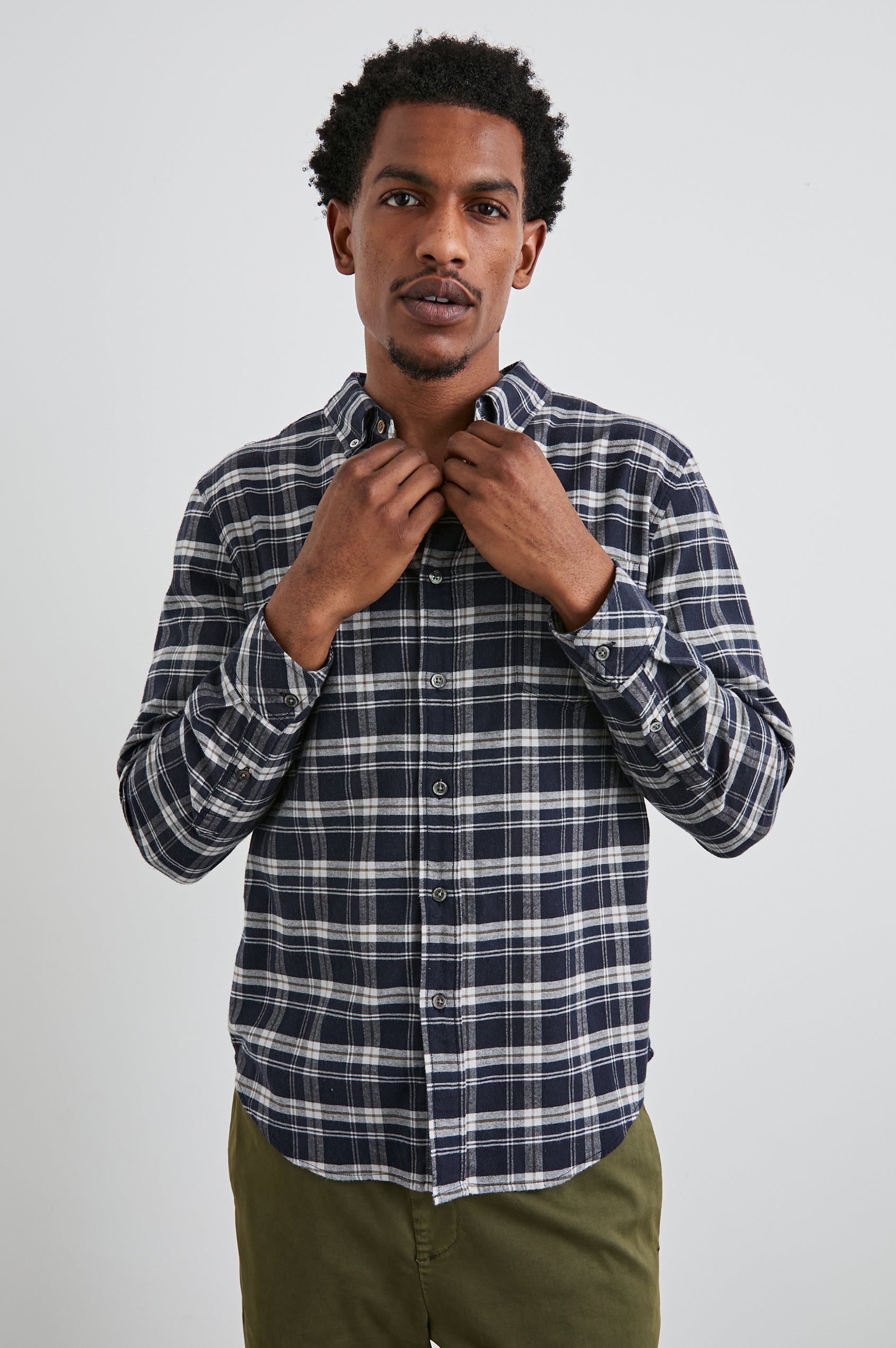 Reid Long-Sleeve Button Up with a Patch Pocket in Navy Lentil Cream Colorway, a Navy, Cream and Brown plaid - Front View Featured on Model