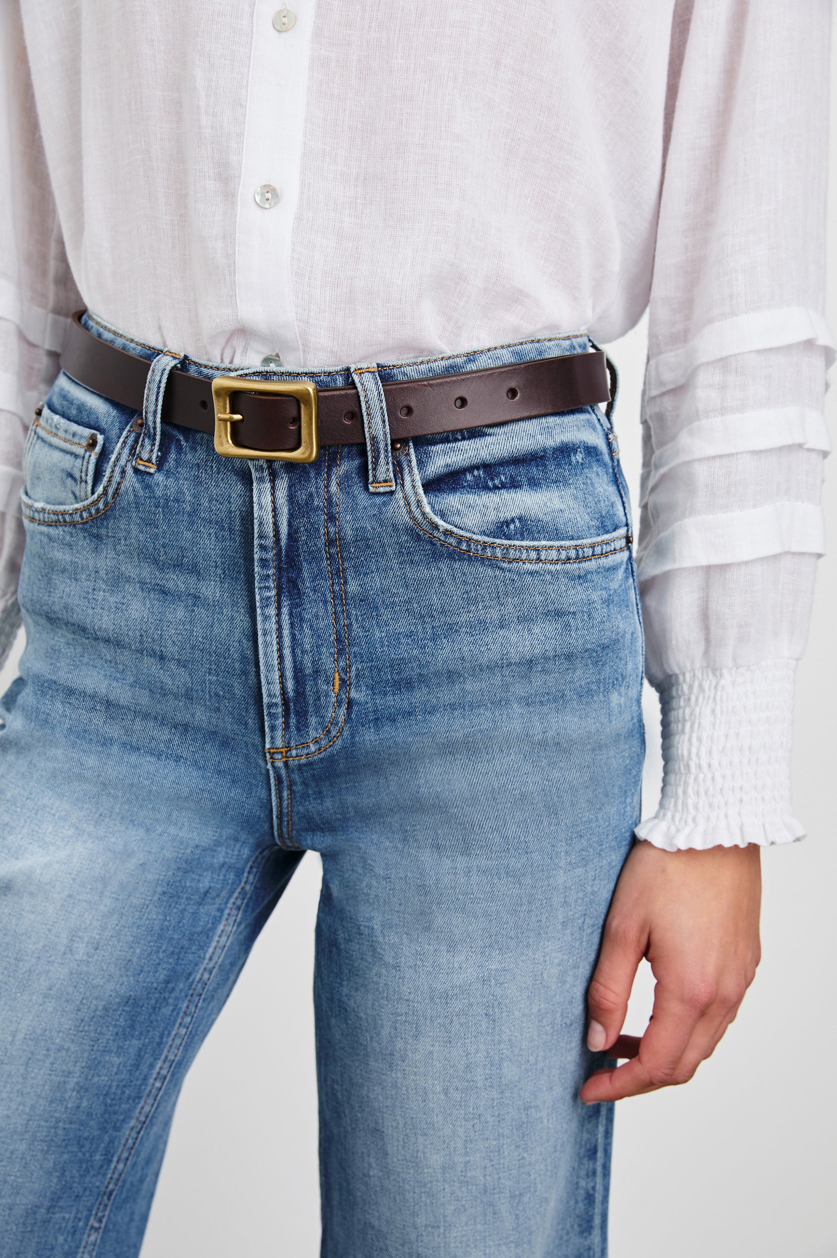 Remi Belt with a Rectangular Buckle with Rounded Corners in Brown Gold Colorway, Brown Belt and Gold-Tone Buckle - Front View Featured on Model