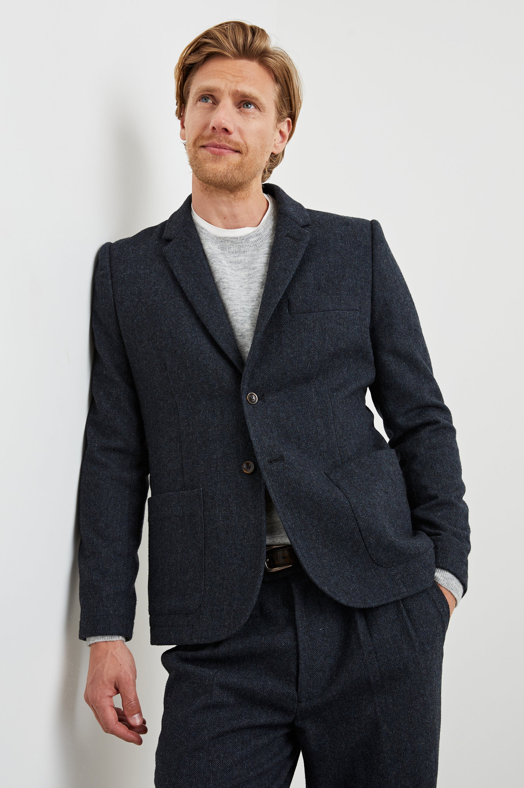 Reynard Blazer with Two Button Closure, Two Front Pockets, a Chest Welt Pocket, Herringbone Fabric in Celestial Tweed Colorway - Front View Featured on Model