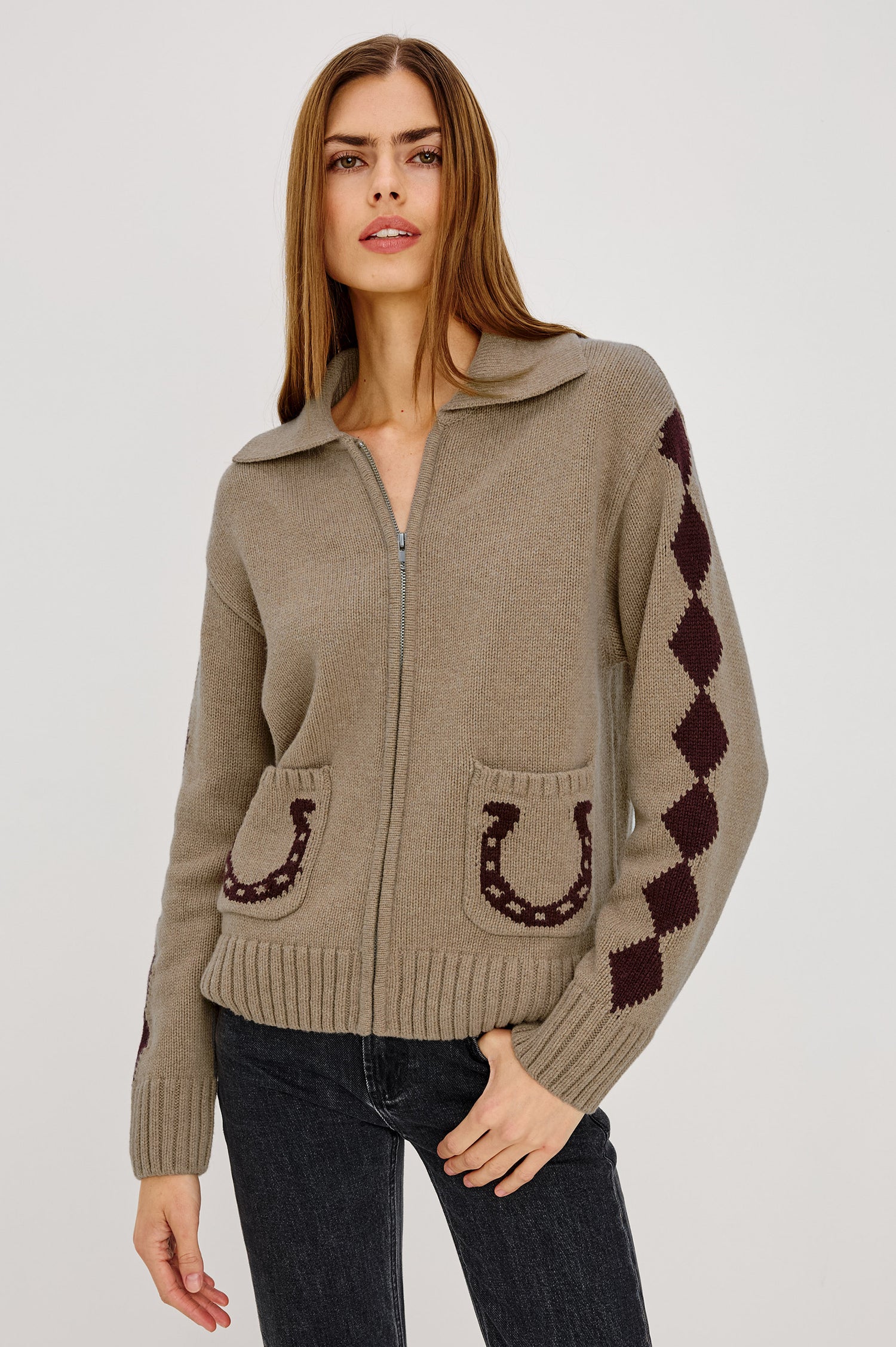 Rhea Sweater in Wool Blened With Intarsia Detailing, Spread Collar, Drop Shoulders, Long Sleeves, Relaxed Fit, Front Zip, and Patch Pockets in Horseshoes Colorway - Upper Body Front View Featured on Model