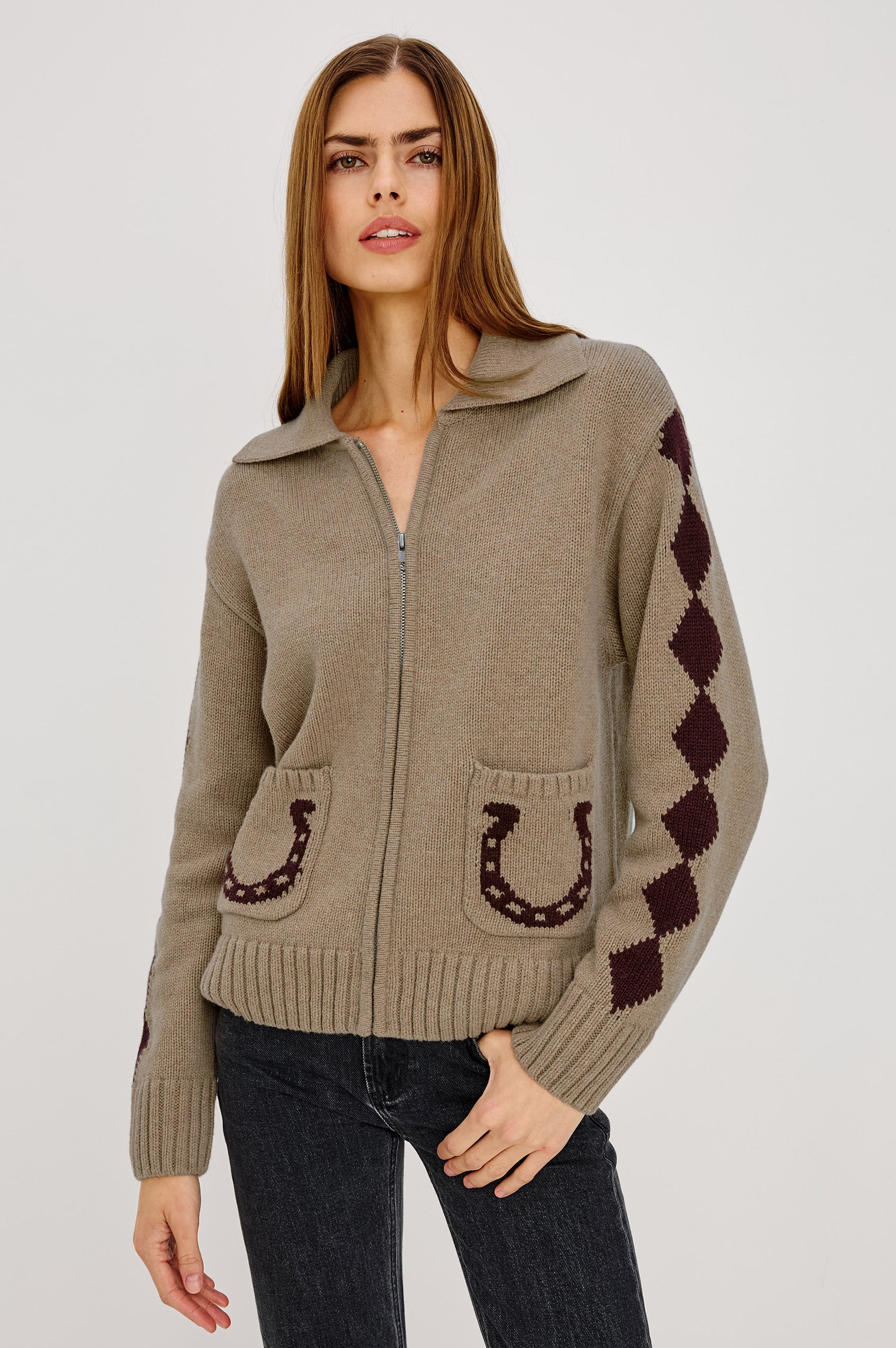 Rhea Sweater in Wool Blened With Intarsia Detailing, Spread Collar, Drop Shoulders, Long Sleeves, Relaxed Fit, Front Zip, and Patch Pockets in Horseshoes Colorway - Upper Body Front View Featured on Model