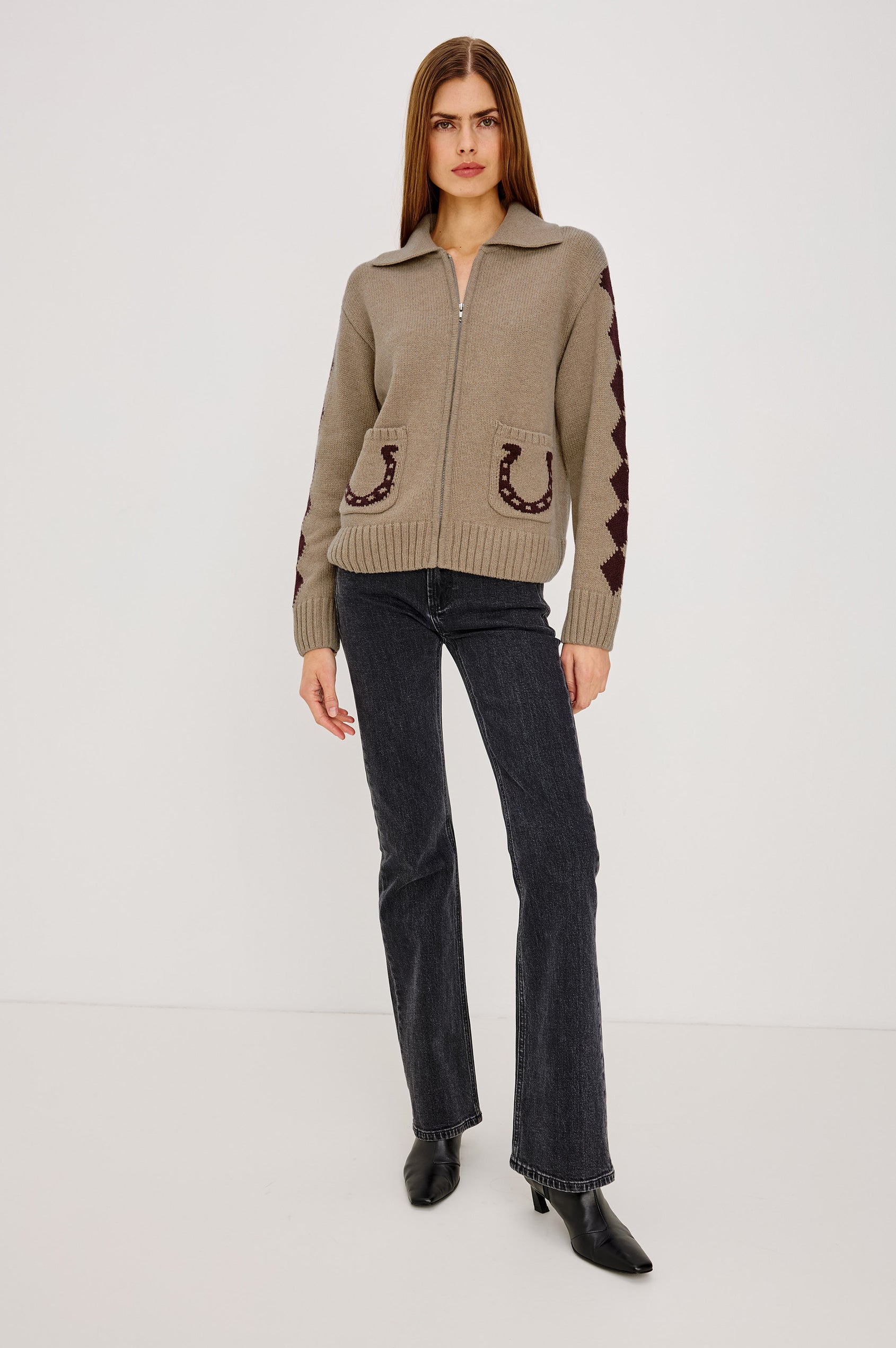 Rhea Sweater in Wool Blened With Intarsia Detailing, Spread Collar, Drop Shoulders, Long Sleeves, Relaxed Fit, Front Zip, and Patch Pockets in Horseshoes Colorway - Full Body Front View Featured on Model