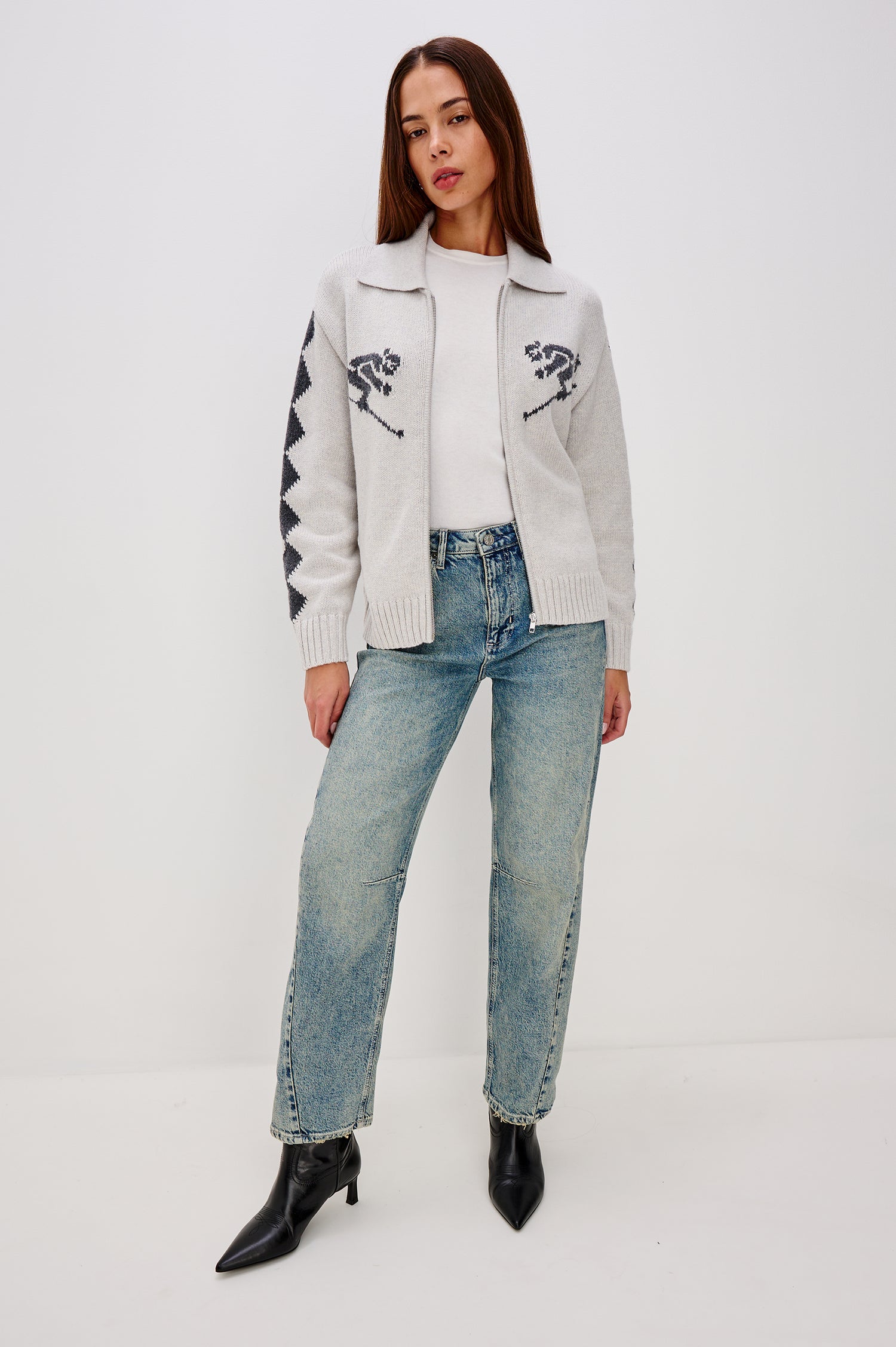 Rhea Longline Cardigan in Wool Blend With Skier Motifs, Stand Collar, Diamond Detailing at Long Sleeves, Relaxed Fit, and Front Zipper in Powder Grey Colorway - Full Body Front View Featured on Model