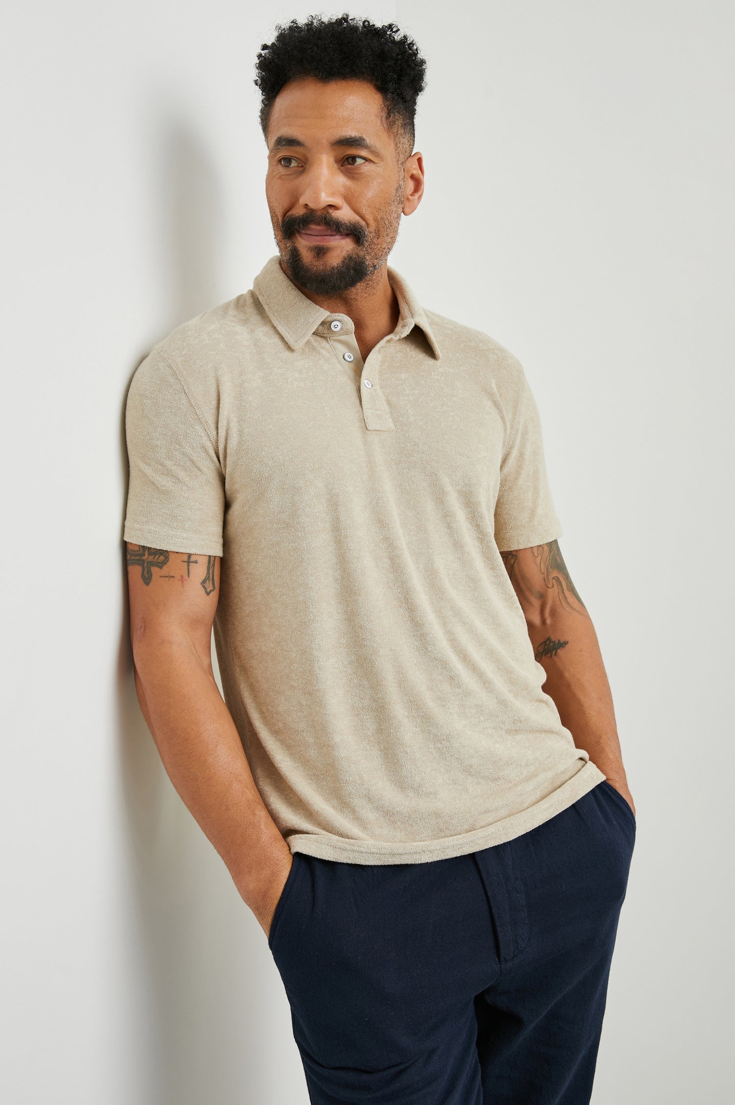 Rhen Short-Sleeve Polo Shirt with a Three-Button Placket in Chickpea Colorway - Front View Featured on Model