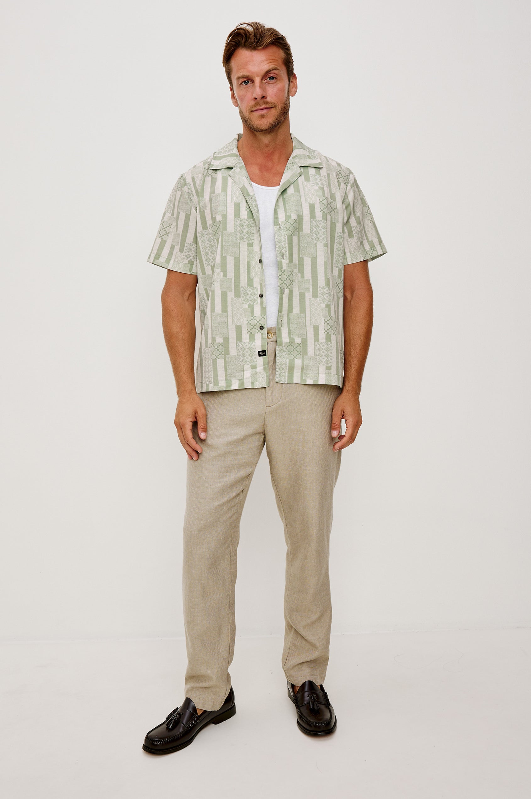 Rhodes Boxy Button-Up Shirt in Crepe With Back Box Pleat, Vintage-Inspired Notched Collar, Front Buttons, and Short Sleeves in Patchwork Stripe Sage Colorway - Full Body Front View Featured on Model