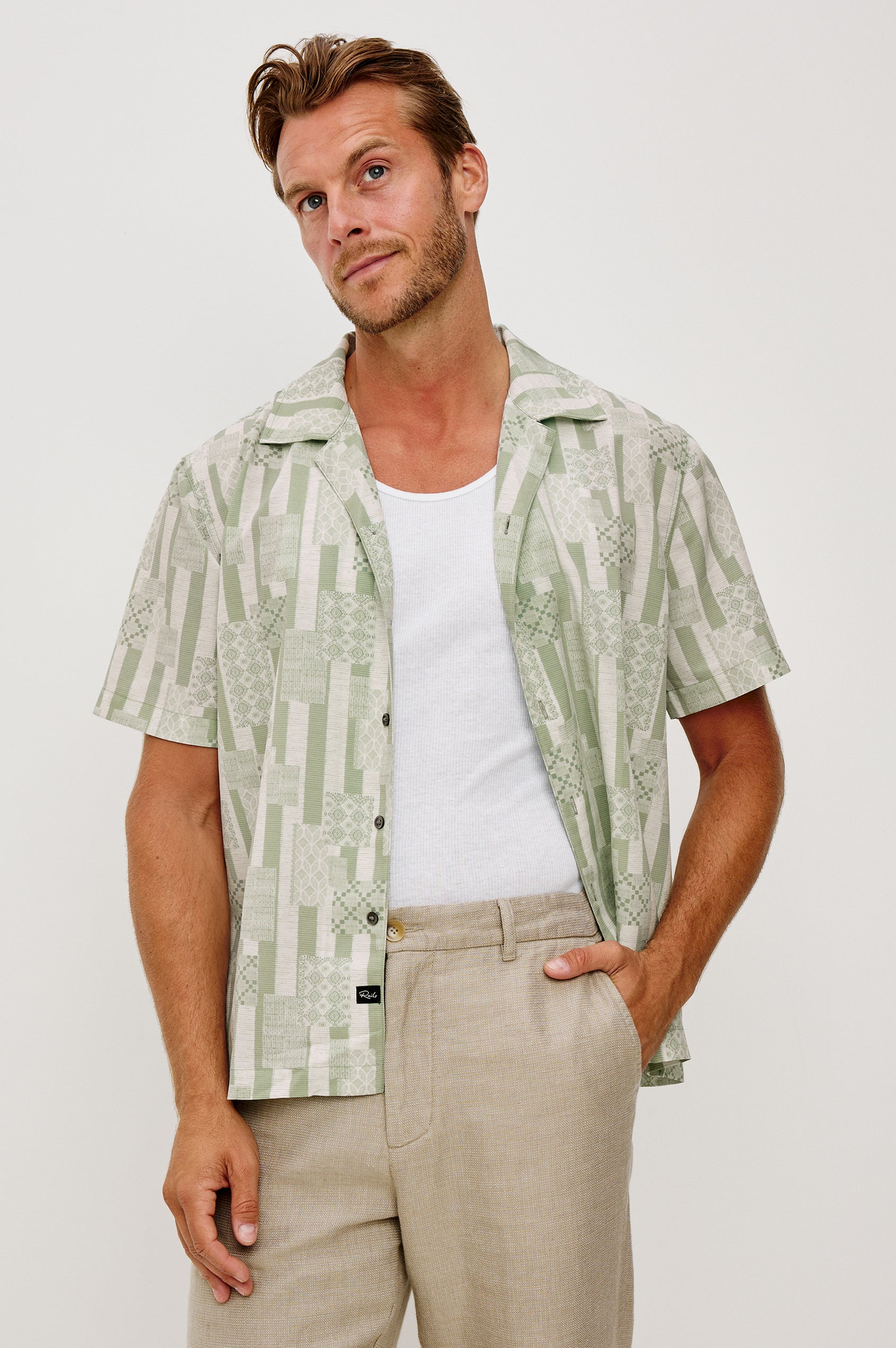 Rhodes Boxy Button-Up Shirt in Crepe With Back Box Pleat, Vintage-Inspired Notched Collar, Front Buttons, and Short Sleeves in Patchwork Stripe Sage Colorway - Upper Body Front View Featured on Model