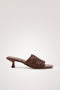 Rimini Mule Heel in Leather With Woven Upper, Square Toe, and Cushioned Footbed With Branded Embossed Detail in Dark Brown Colorway - Side View Featured
