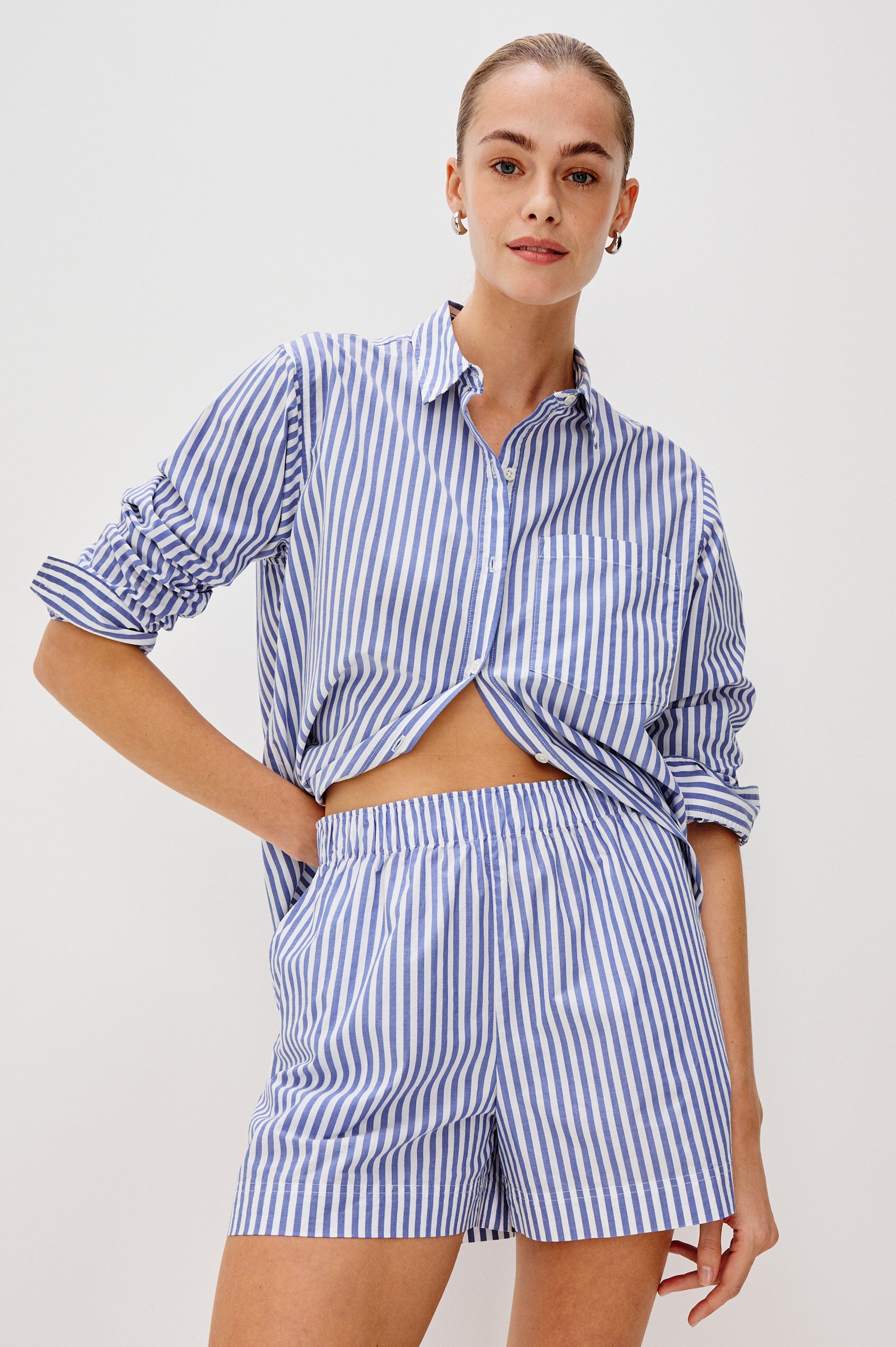 Rocky mid rise, loose fitting cotton short with elastic waistband and side pockets in Mariner White Stripe colorway - front view on model.