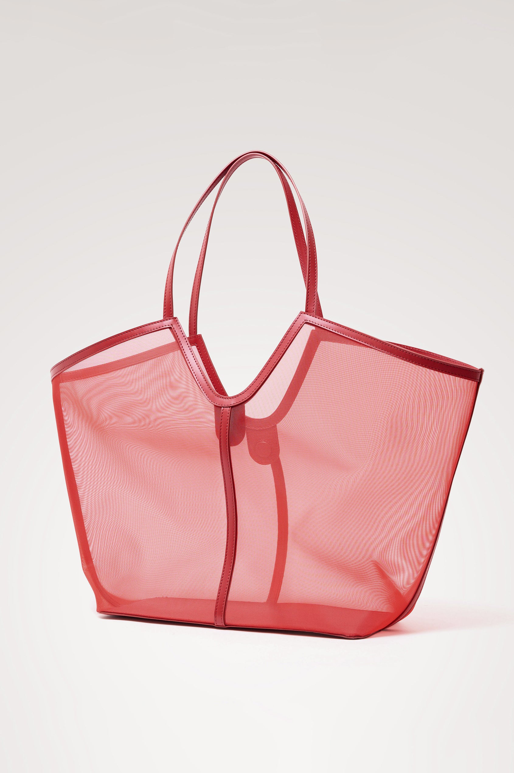 Roma Tote in Mesh With Spacious Trapeze Shape, Leather Trim, and Top Handles in Tomato Colorway - Side View Featured