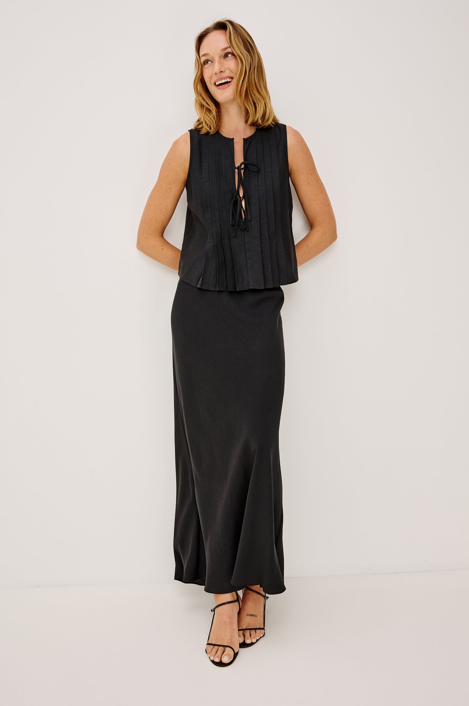 Romina Maxi Skirt in Luxe Linen With High-Waisted Fit and Elastic Waistband in Black Linen Colorway - Full Body Front View Featured on Model