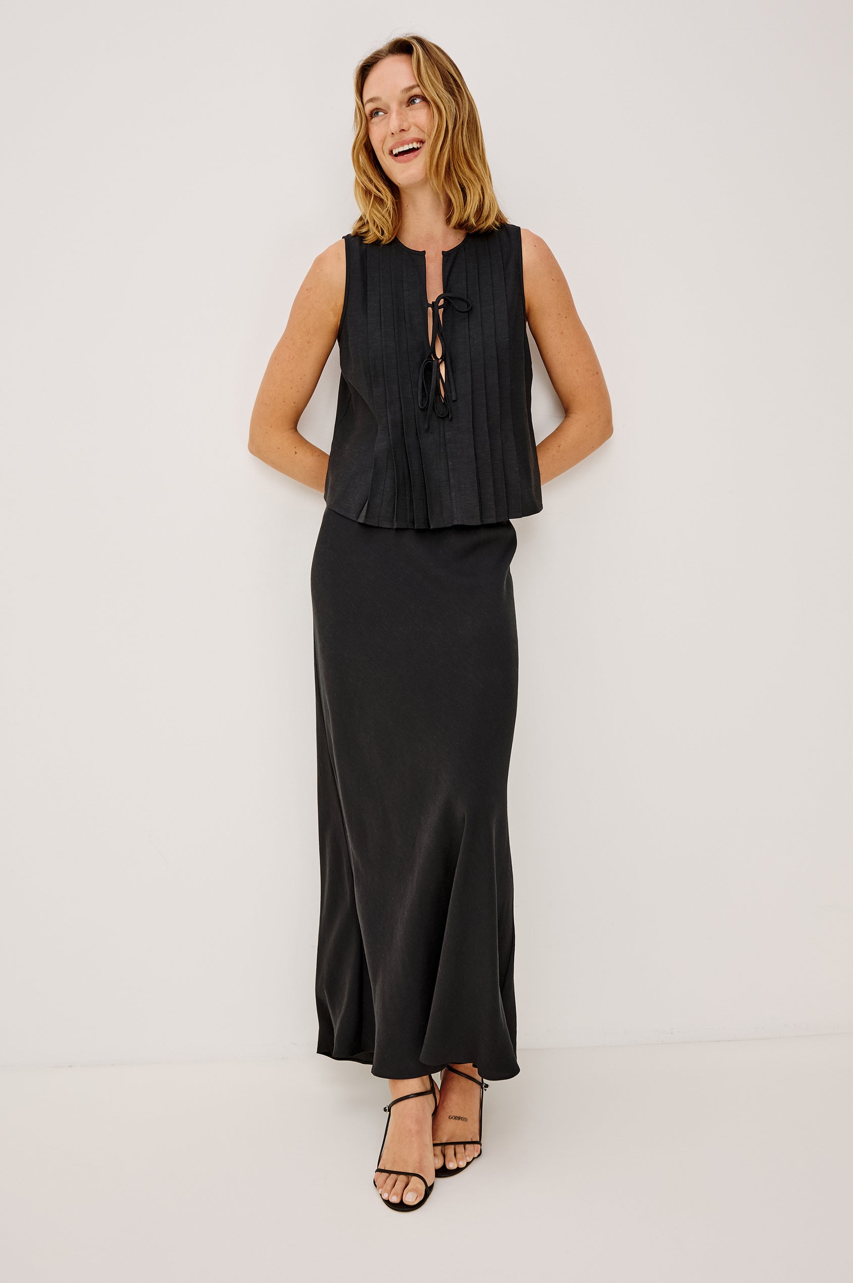 Romina Maxi Skirt in Luxe Linen With High-Waisted Fit and Elastic Waistband in Black Linen Colorway - Full Body Front View Featured on Model