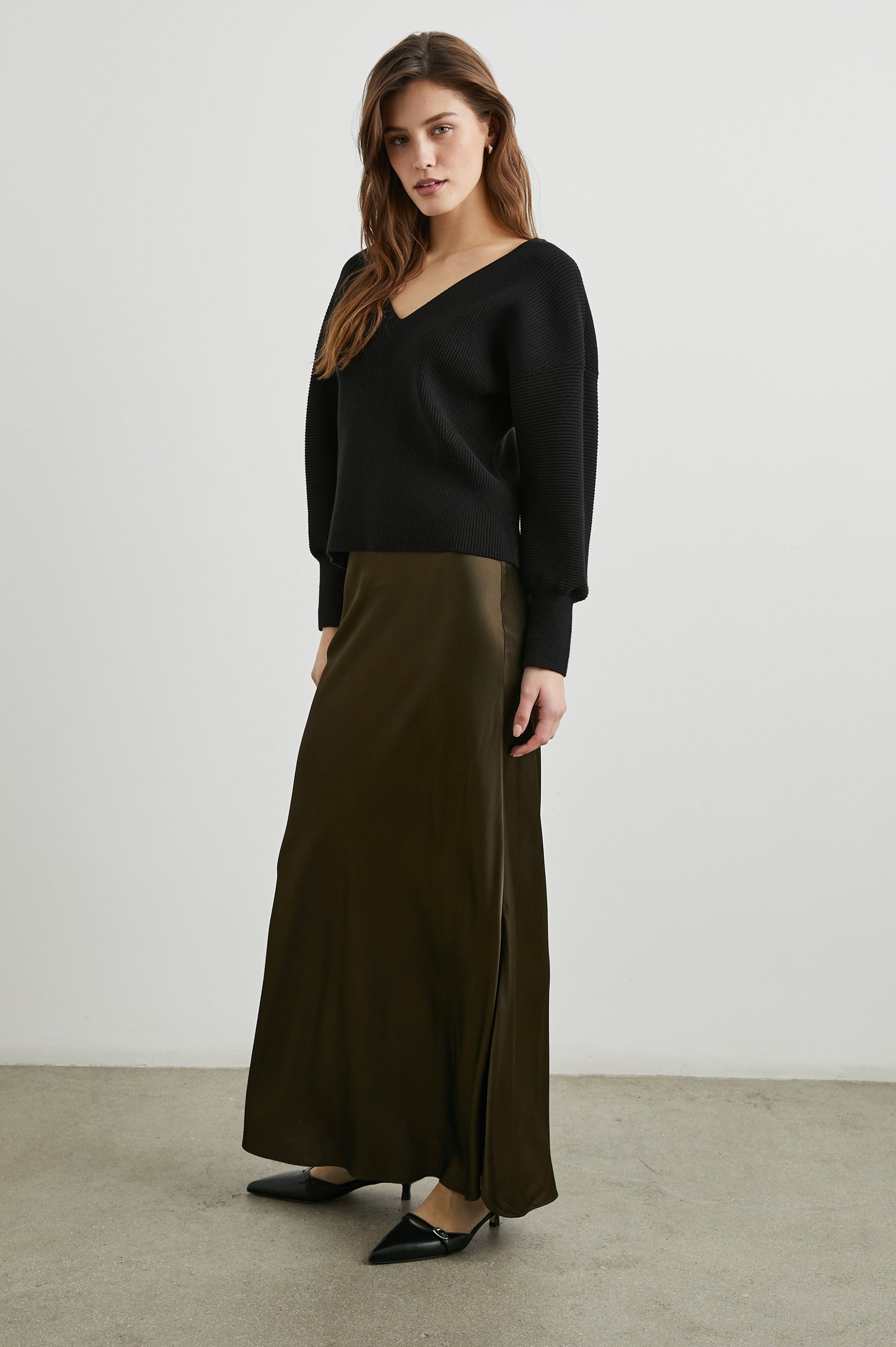 Romina Maxi Skirt in Dark Moss Colorway - Front Full Body View Featured on Model