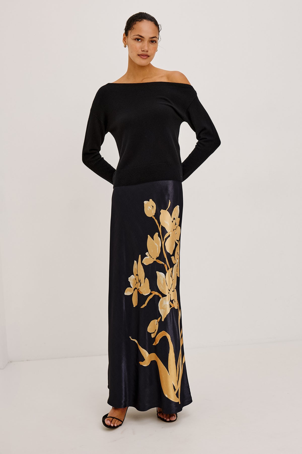 Romina Skirt in Satin With Floral Placement Print, Bias Cut, and Maxi Length in Gold Lily Colorway - Full Body Front View Featured on Model.