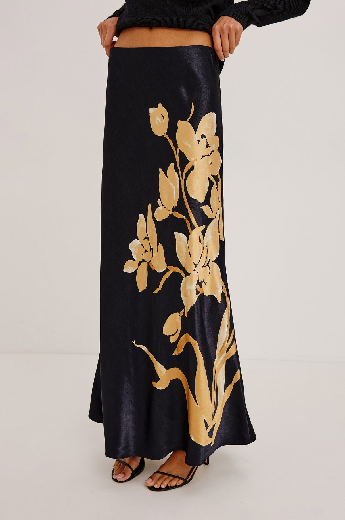 Romina Skirt in Satin With Floral Placement Print, Bias Cut, and Maxi Length in Gold Lily Colorway - Front View Featured on Model.