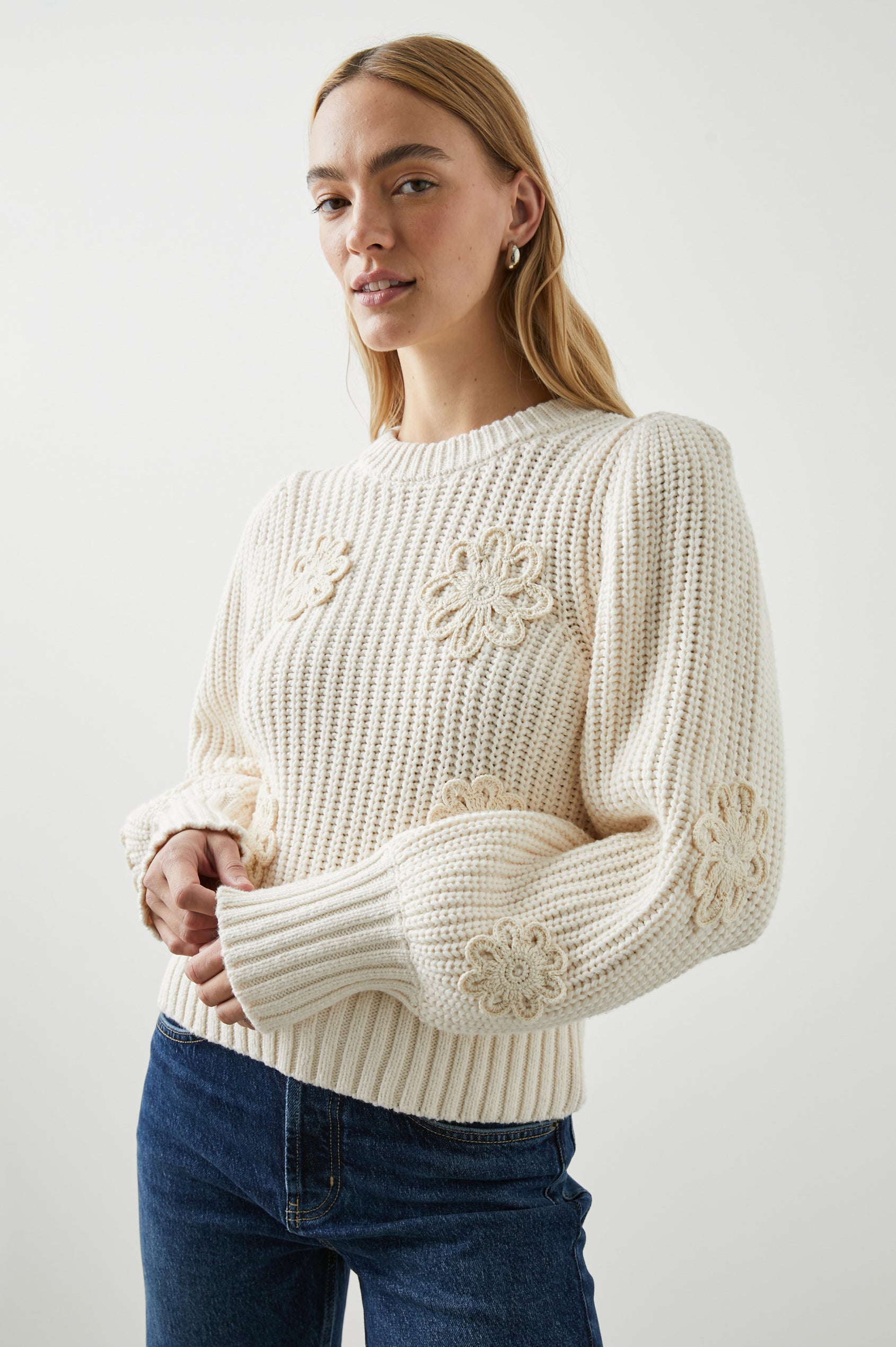 Romy Long-Sleeve Knit Sweater with Crew Neck, Ribbed Trim and Crochet Daisies in Ivory Crochet Daisies Colorway - Front View Featured on Model 