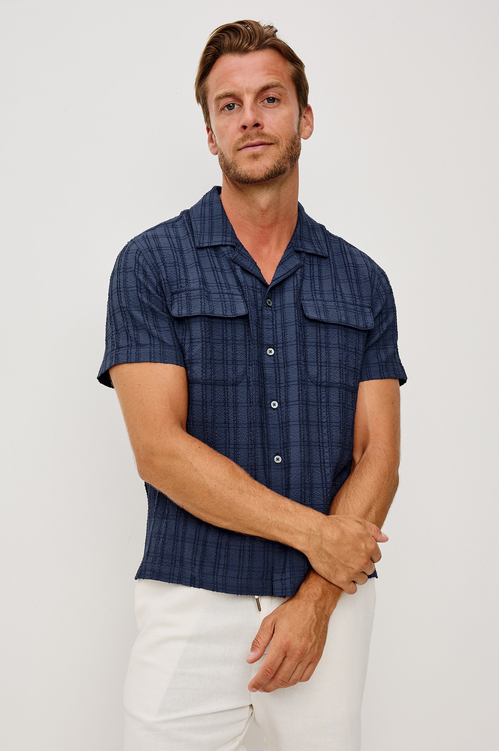 Rook Button-Up Shirt With Crosshatch Texture, Notched Collar, Short Sleeves, and Slightly Boxy Fit in Navy Colorway - Upper Body Front View Featured on Model