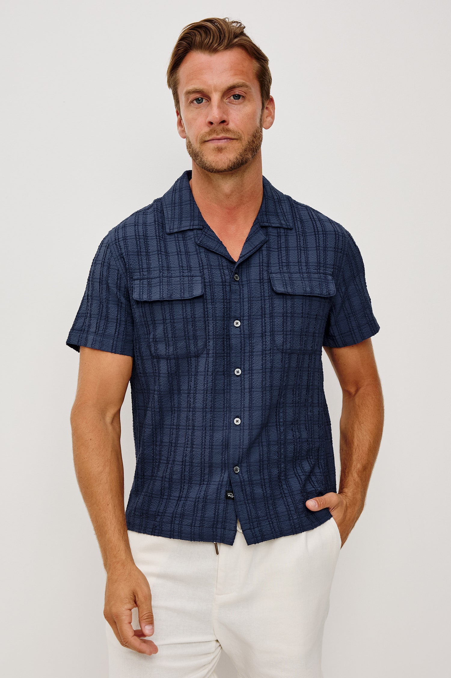 Rook Button-Up Shirt With Crosshatch Texture, Notched Collar, Short Sleeves, and Slightly Boxy Fit in Navy Colorway - Upper Body Front View Featured on Model