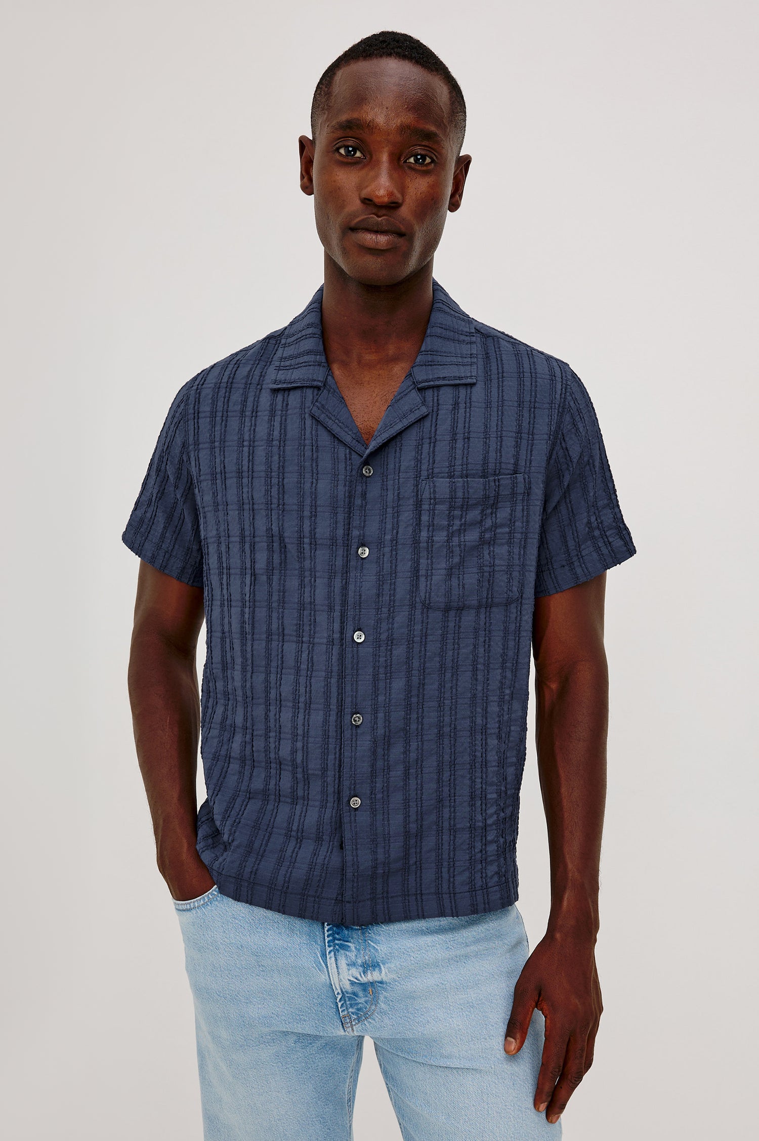 Rook Button-Up Shirt With Crosshatch Texture, Notched Collar, Short Sleeves, and Slightly Boxy Fit in Navy Colorway - Upper Body Front View Featured on Model