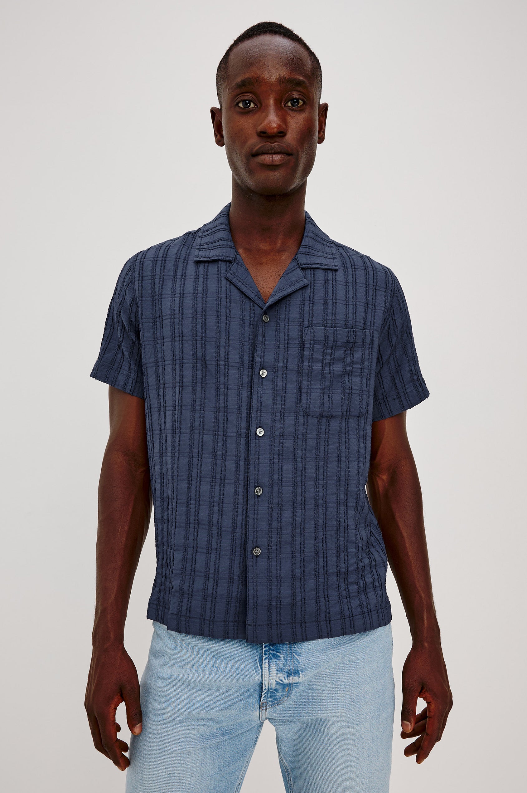 Rook Button-Up Shirt With Crosshatch Texture, Notched Collar, Short Sleeves, and Slightly Boxy Fit in Navy Colorway - Upper Body Back View Featured on Model