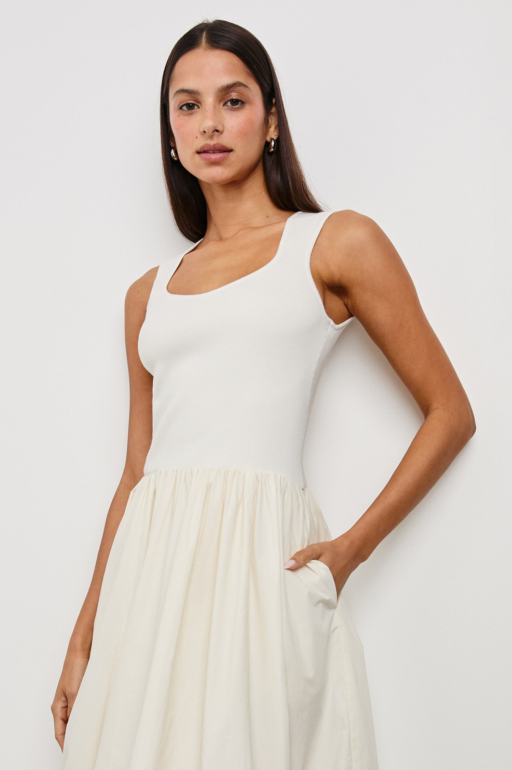 Rosalind tank midi dress with scoop neck, fitted bodice, and bubble skirt in Ivory -  close up of details on model