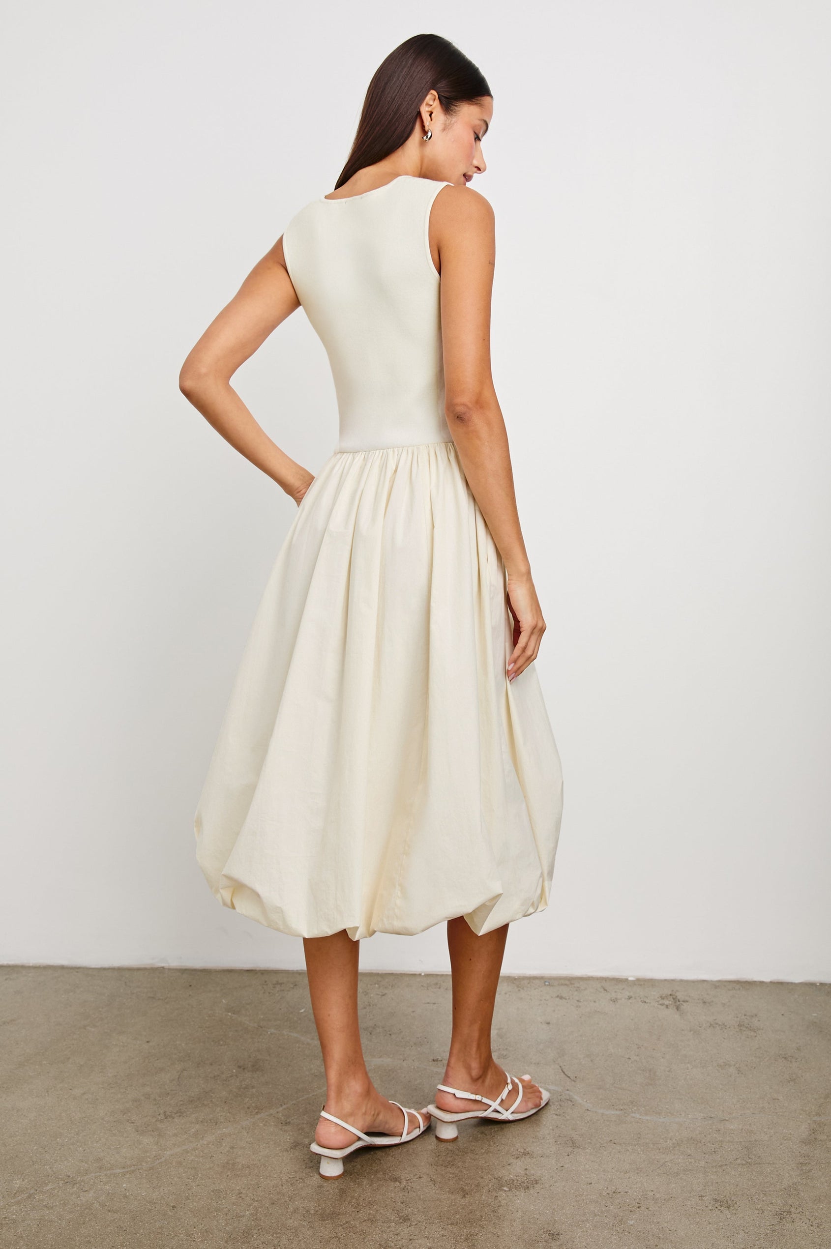 Rosalind tank midi dress with scoop neck, fitted bodice, and bubble skirt in Ivory -  back view on model