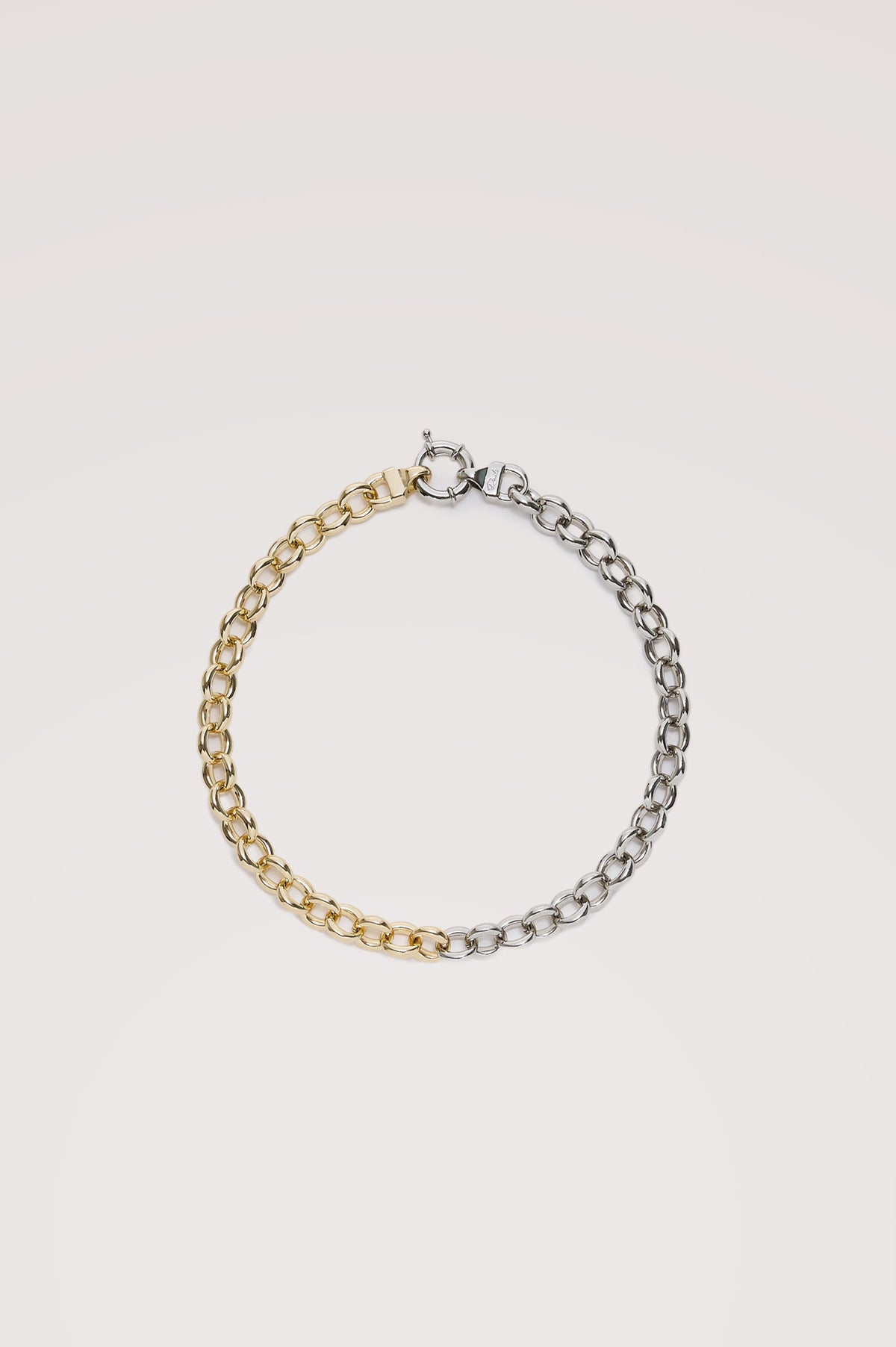 Round Link Chain Necklace With Chunky Round Links With Mixed-Metal Design, Toggle Closure, and Engraved Rails Logo at Interior in Silver Gold Colorway - Flat lay view featured.