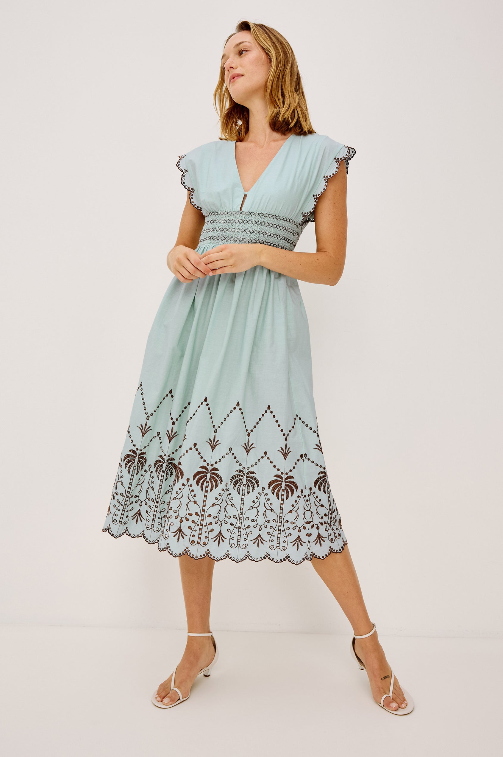 Roxanne Midi Dress in Cotton Poplin With Shirred Shoulders, Plunging V-Neck, and Smocked Waist in Ocean Palms Embroidery - Full Body Front View Featured on Model