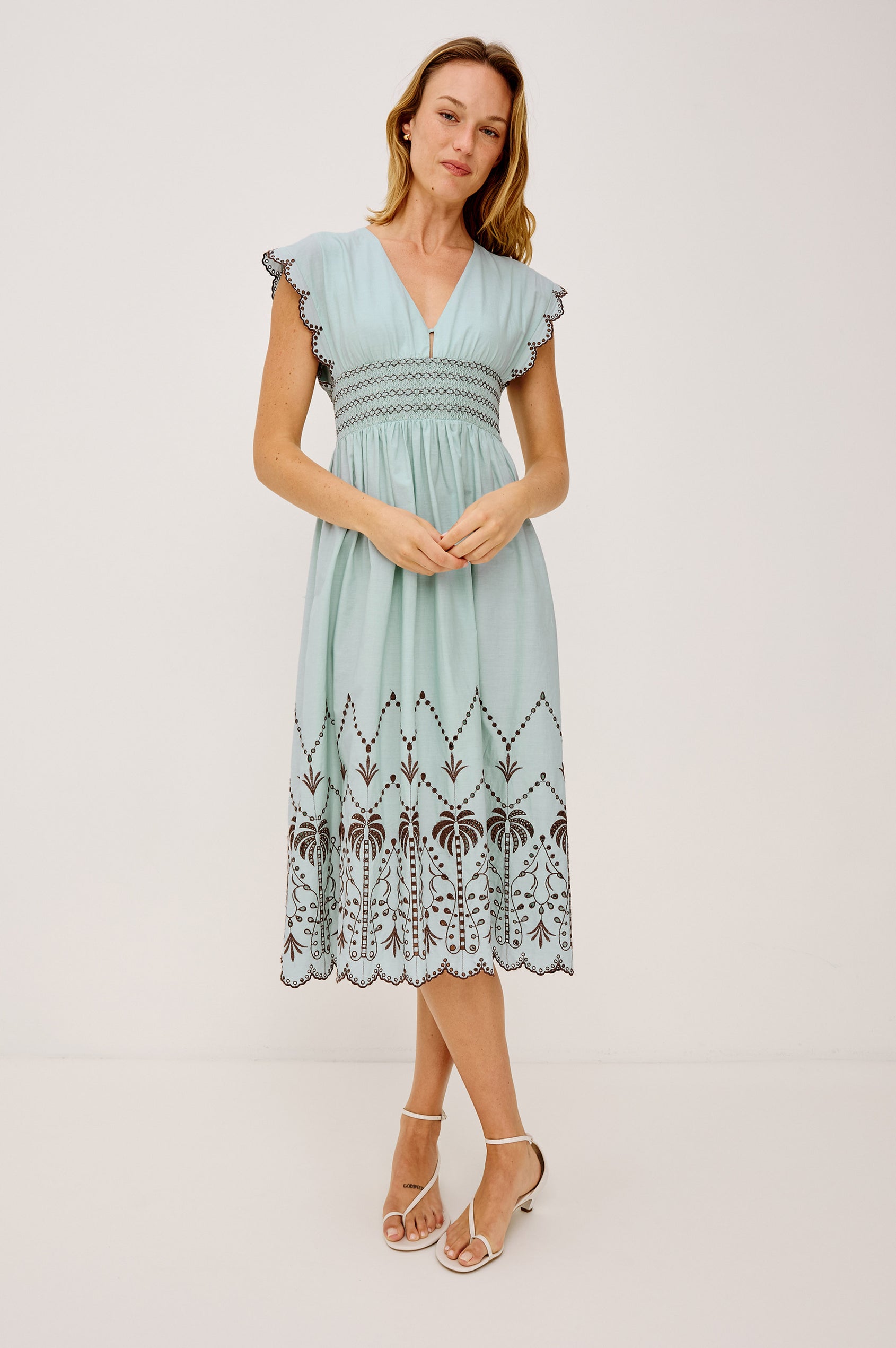 Roxanne Midi Dress in Cotton Poplin With Shirred Shoulders, Plunging V-Neck, and Smocked Waist in Ocean Palms Embroidery - Full Body Front View Featured on Model