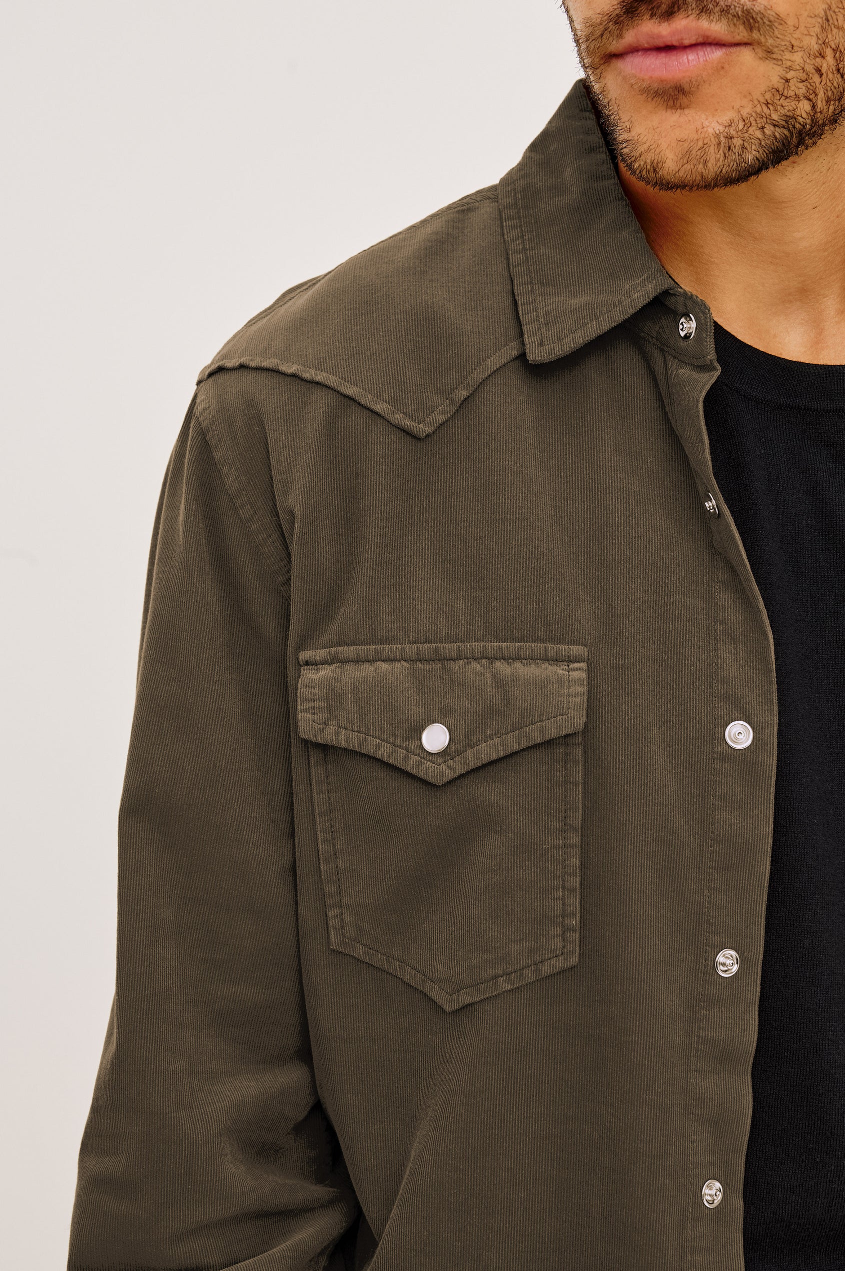 Roy Shirt in Fine Wale Corduroy With Western Shoulder and Back Yokes, Spread Collar, Snap Front, Dual Chest Flap Pockets, and Shirttail Hem in Acacia Colorway - Upper Body Front View Featured on Model